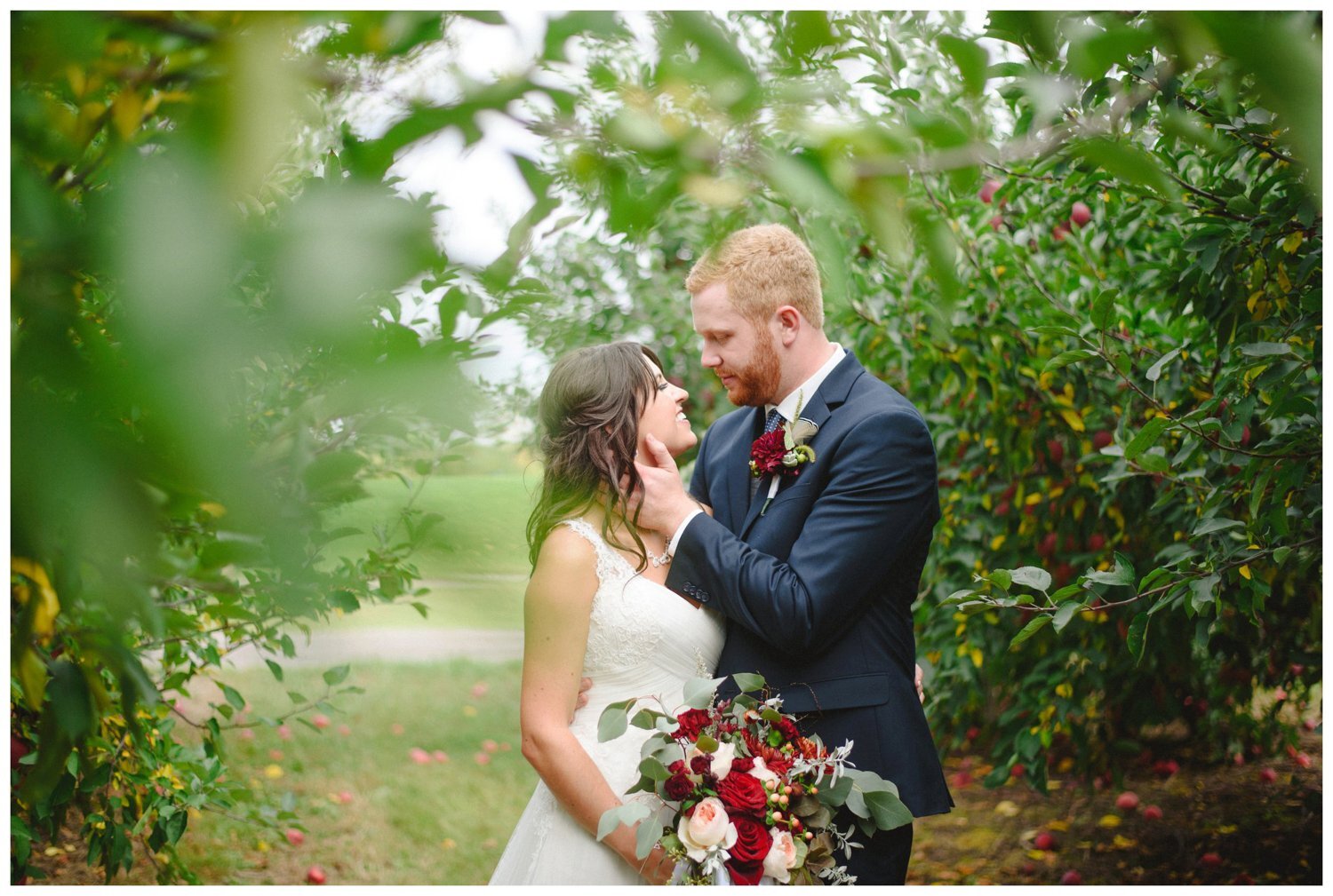 bride and groom at an apple orchard at The Greens at Renton Wedding