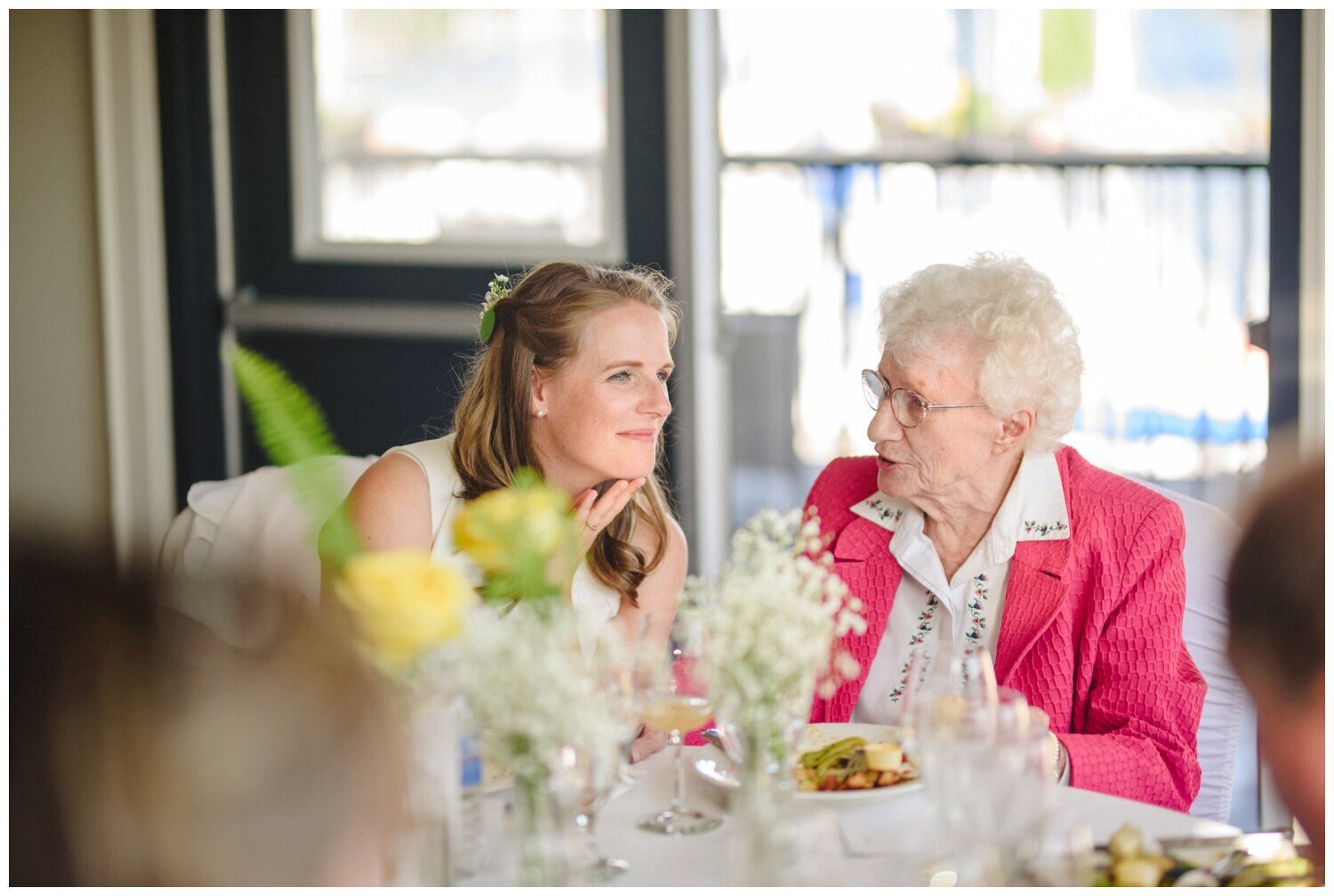 bride speaking with her grandmother at intimate wedding at Barrie Yacht Club