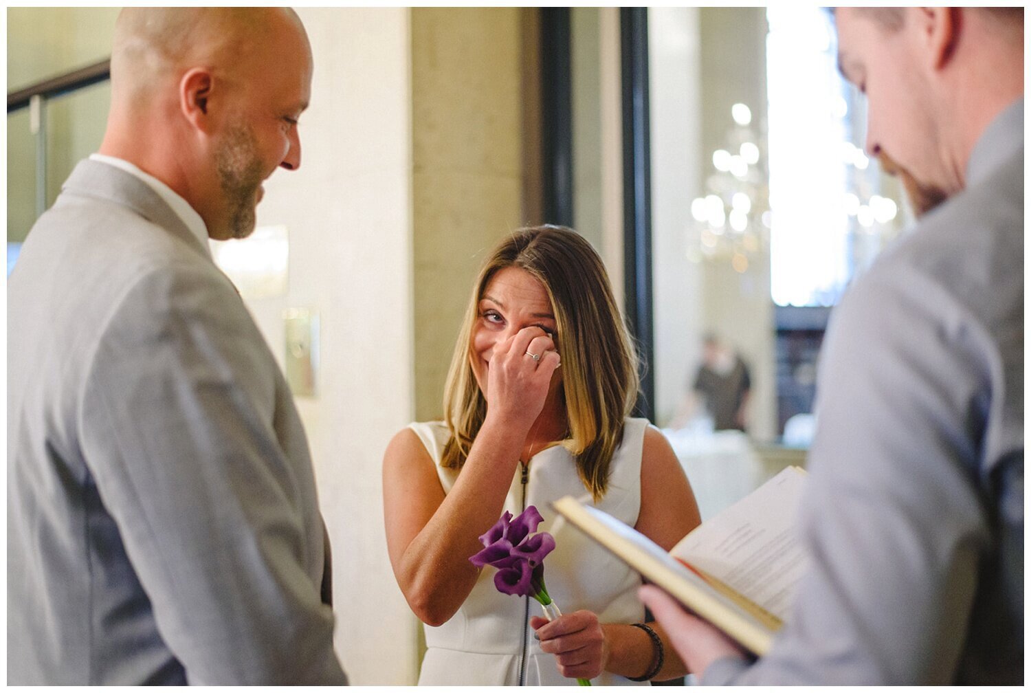 bride crying during elopement at One King West in Toronto