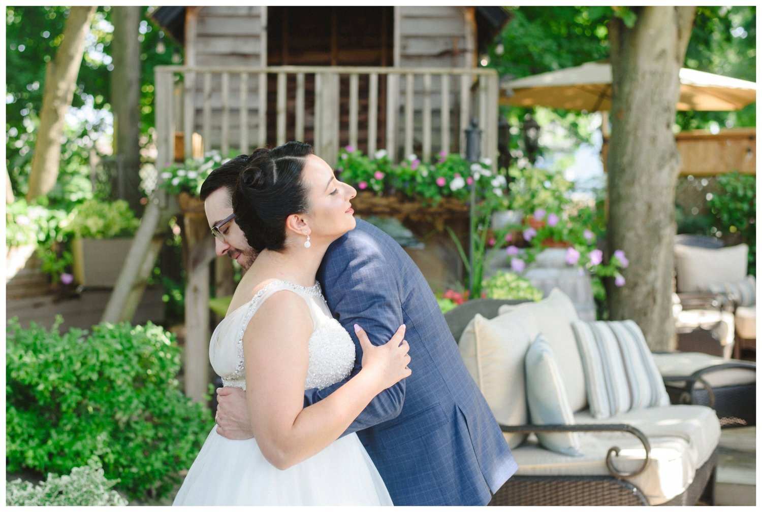bride and groom hugging during first look at backyard Ajax wedding