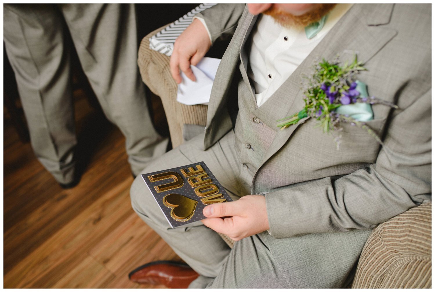 groom reading card from his bride at Tosca Banquet Hall Wedding in Oshawa