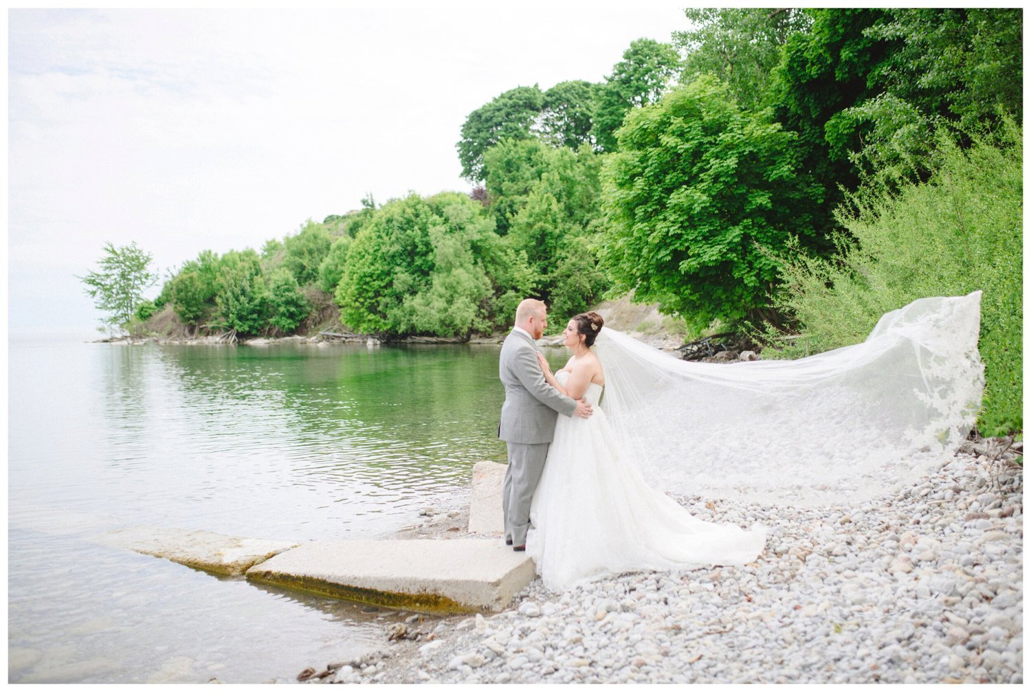Bride and groom by the water in Oshawa