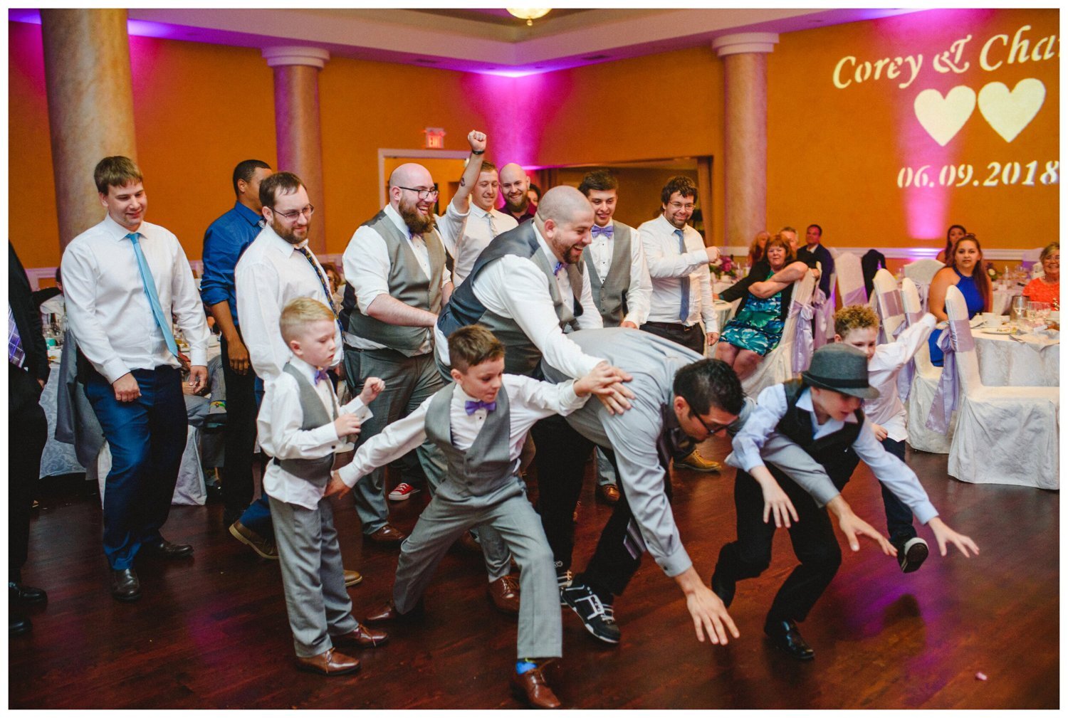 groomsmen catching the garter at Tosca Banquet Hall Wedding in Oshawa