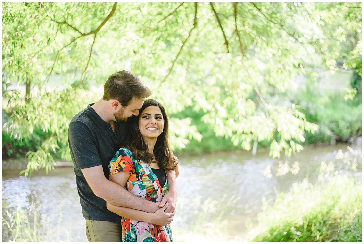 coupe by the river at Oshawa Botanical Gardens Engagement Shoot