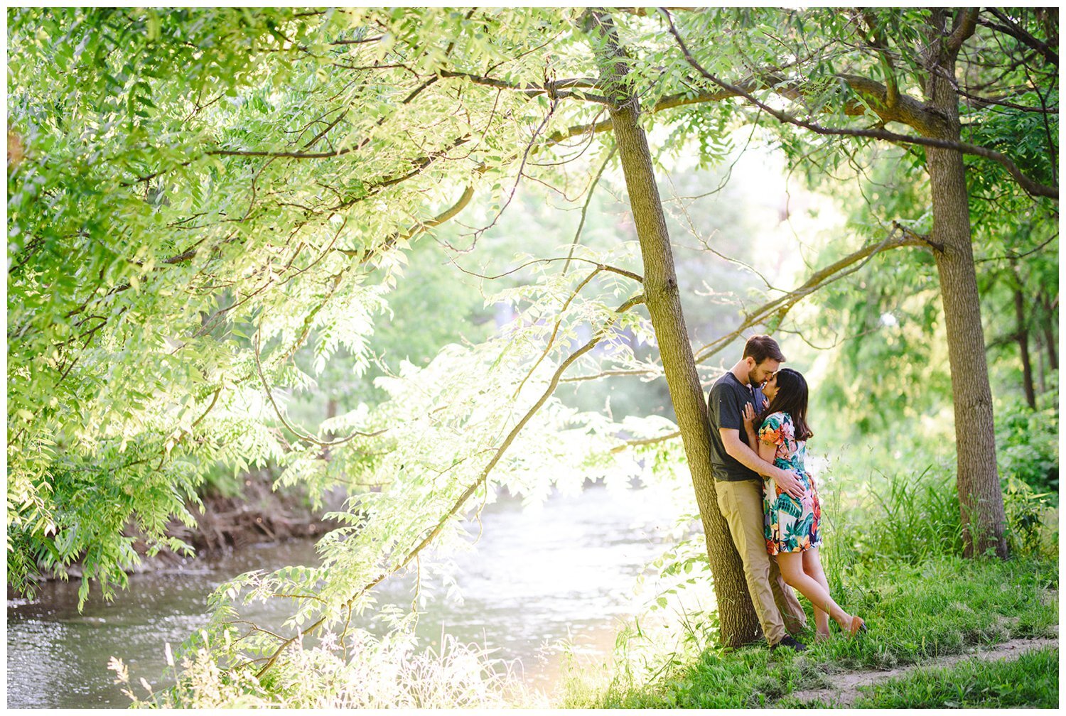 couple at the river by sunset at Oshawa Botanical Gardens Engagement Shoot
