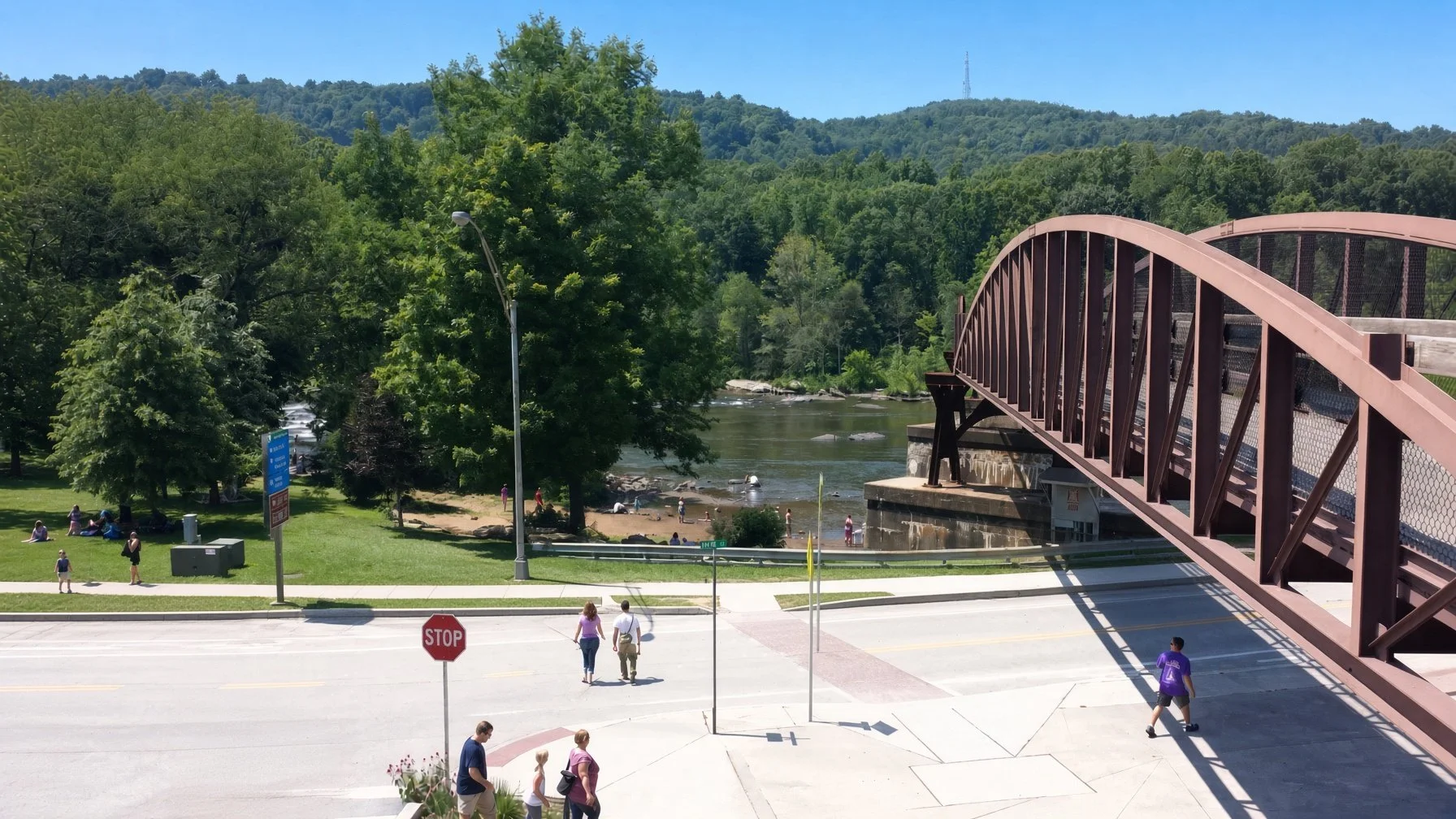 People walking though downtown Ohiopyle