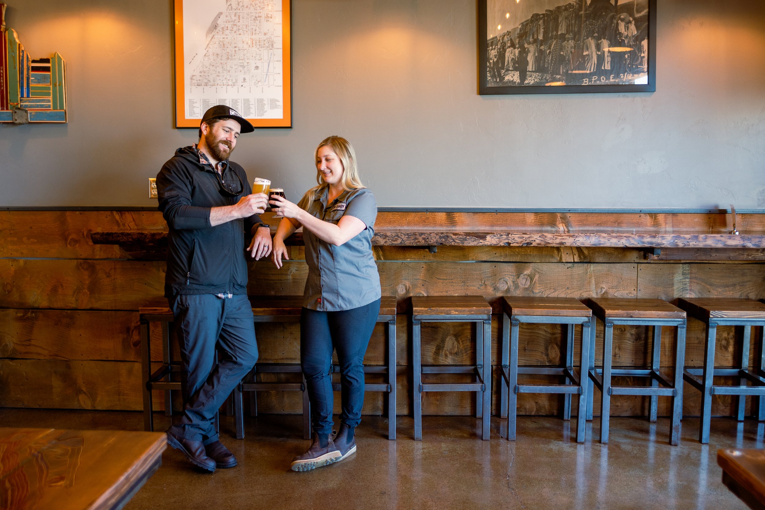  Jim Dandy Brewing owners Davis and Hailee Gove lift a glass in their Pocatello brewery. 