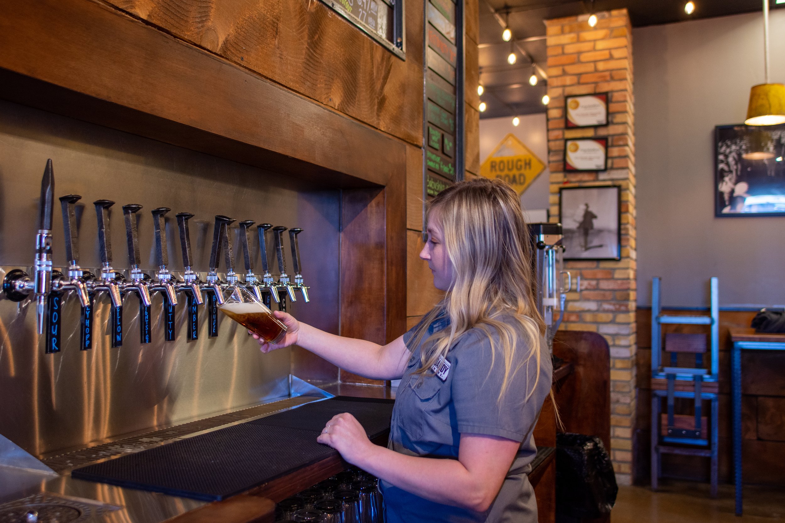  Hailee Gove fills a pint from the taps at Jim Dandy Brewing. 