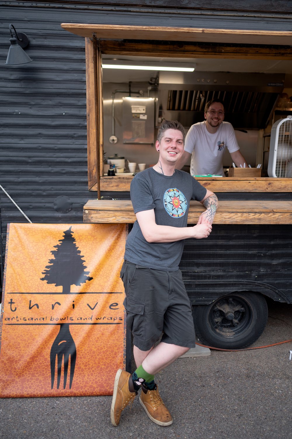 Patrick Shepherd-Blalock (in front) and Noah Espinoza (inside truck) are the chefs of Thrive.