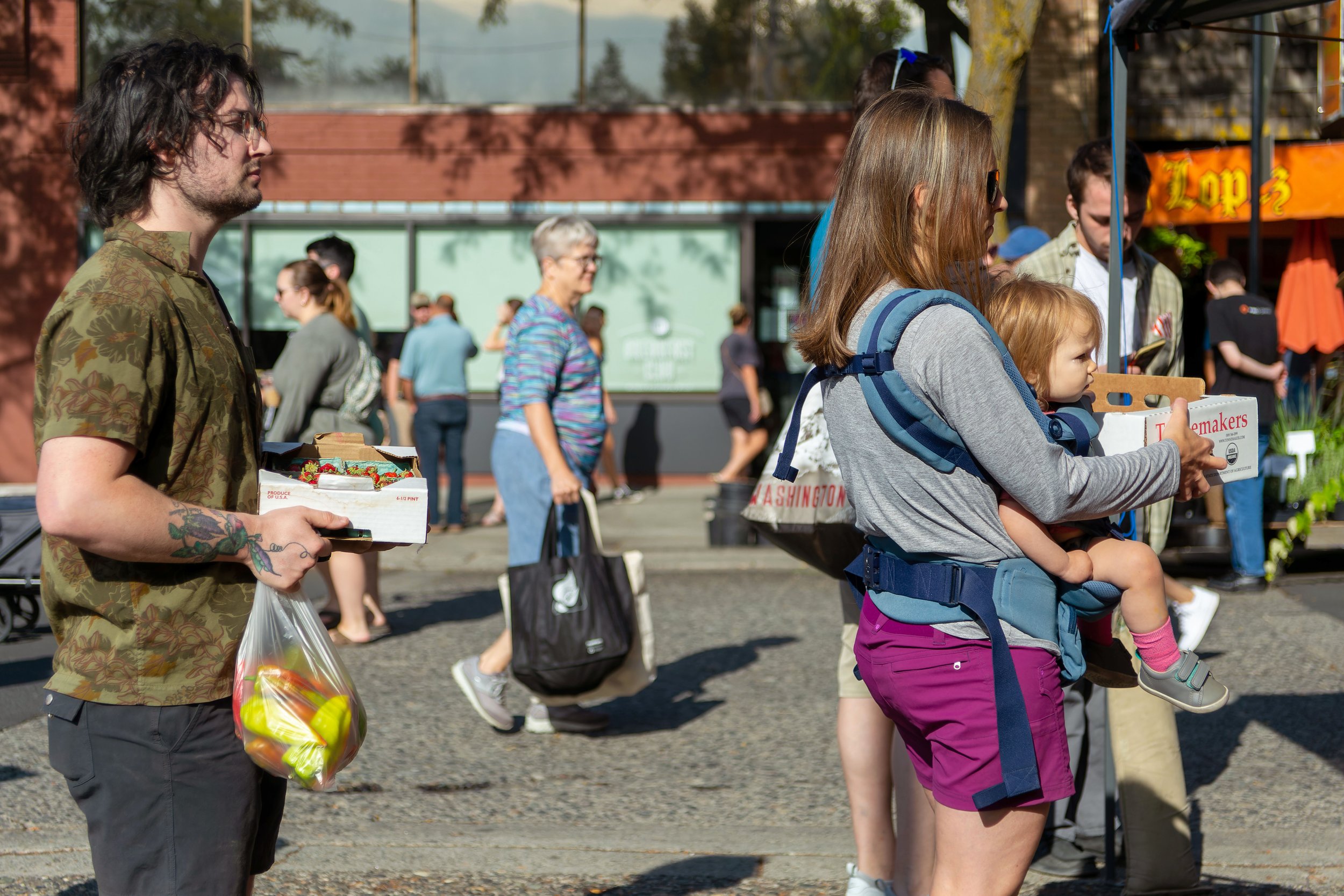 Pecoraro stands in line to buy produce at the Moscow Farmers Market.