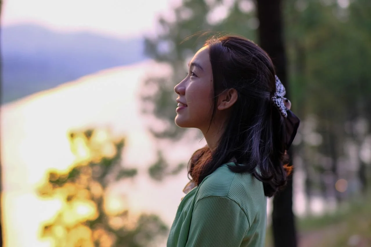 serene-portrait-by-a-riverside-at-sunset