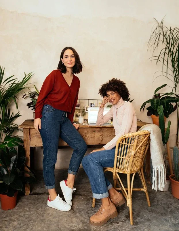 Two women at a desk.