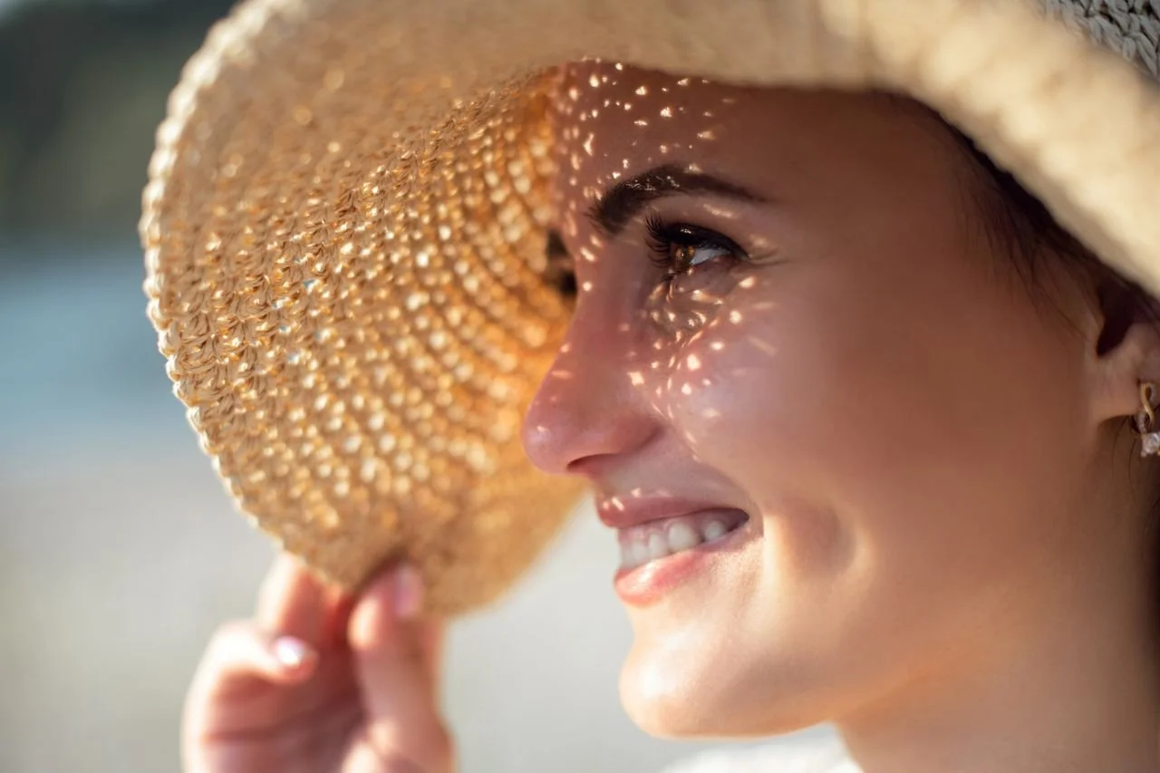 close-up-shot-of-a-woman-wearing-a-sun-hat