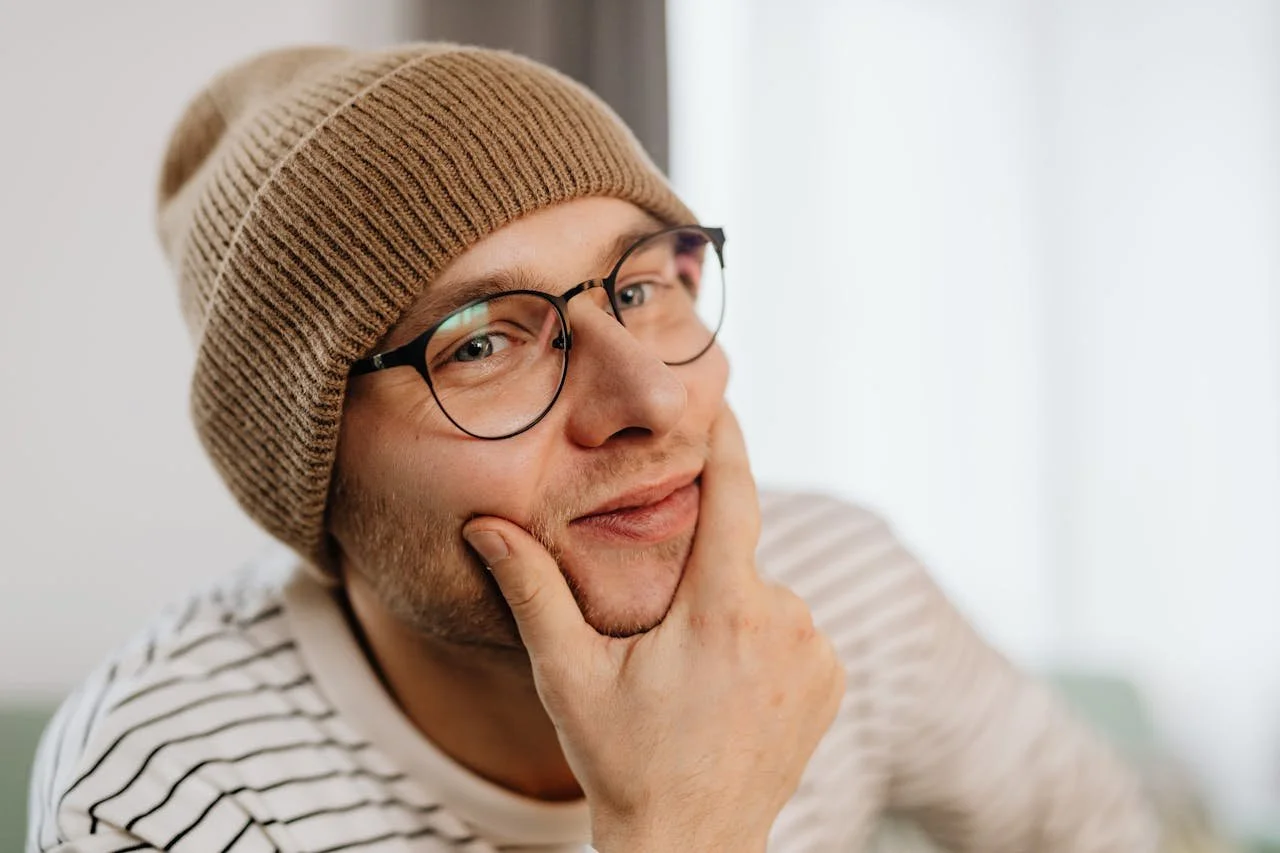 man-in-a-beanie-with-a-hand-on-his-chin