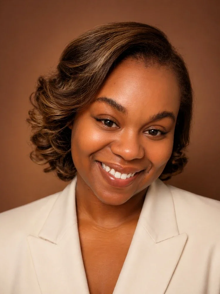 A headshot of Terrace Blake, smiling.