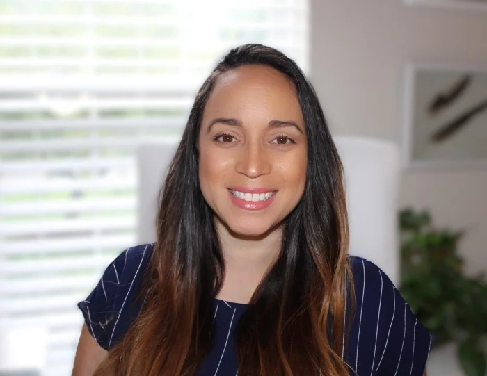 A headshot of Jenny Dees, smiling.