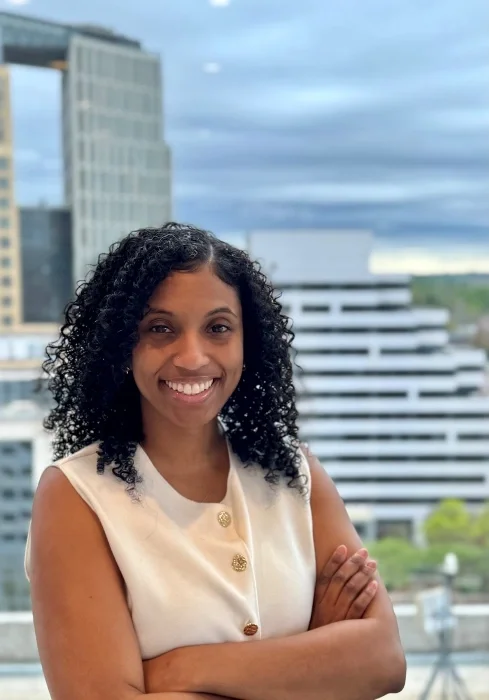 A headshot of Diamon Johnson, smiling.