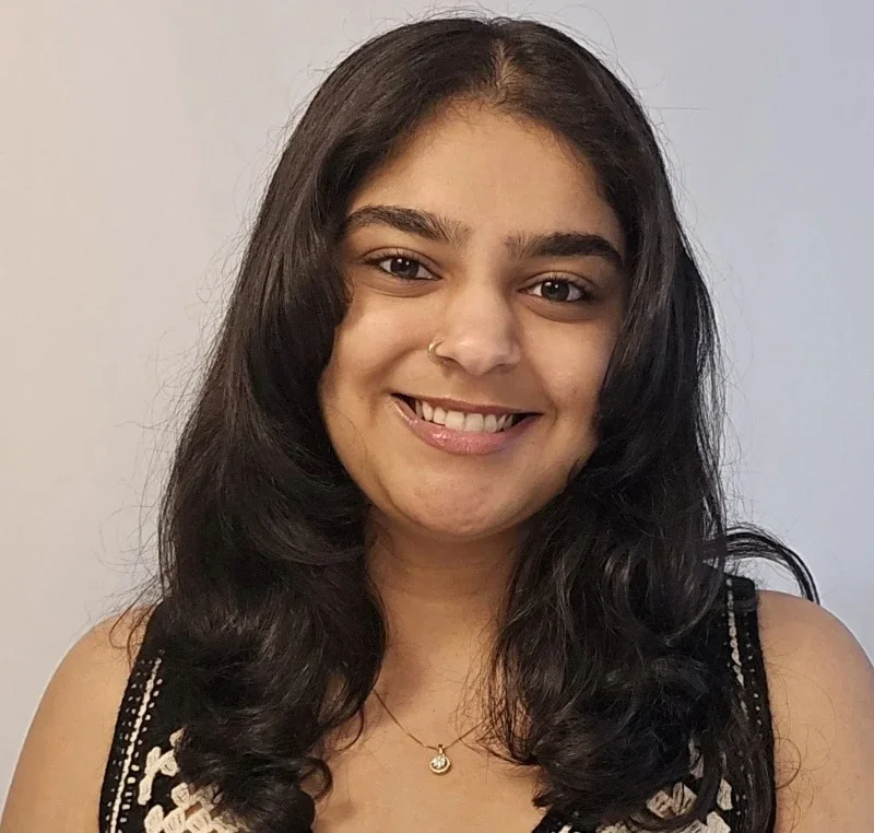 A headshot of Foram Pare, smiling.