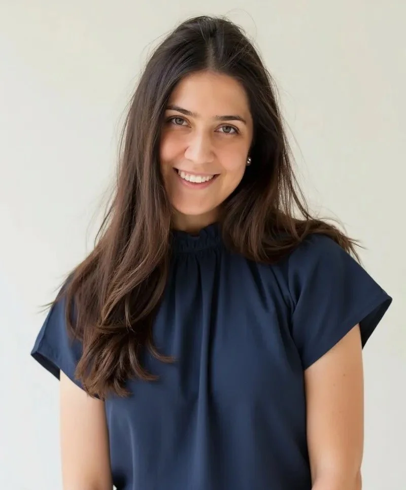 Woman with long black hair smiling
