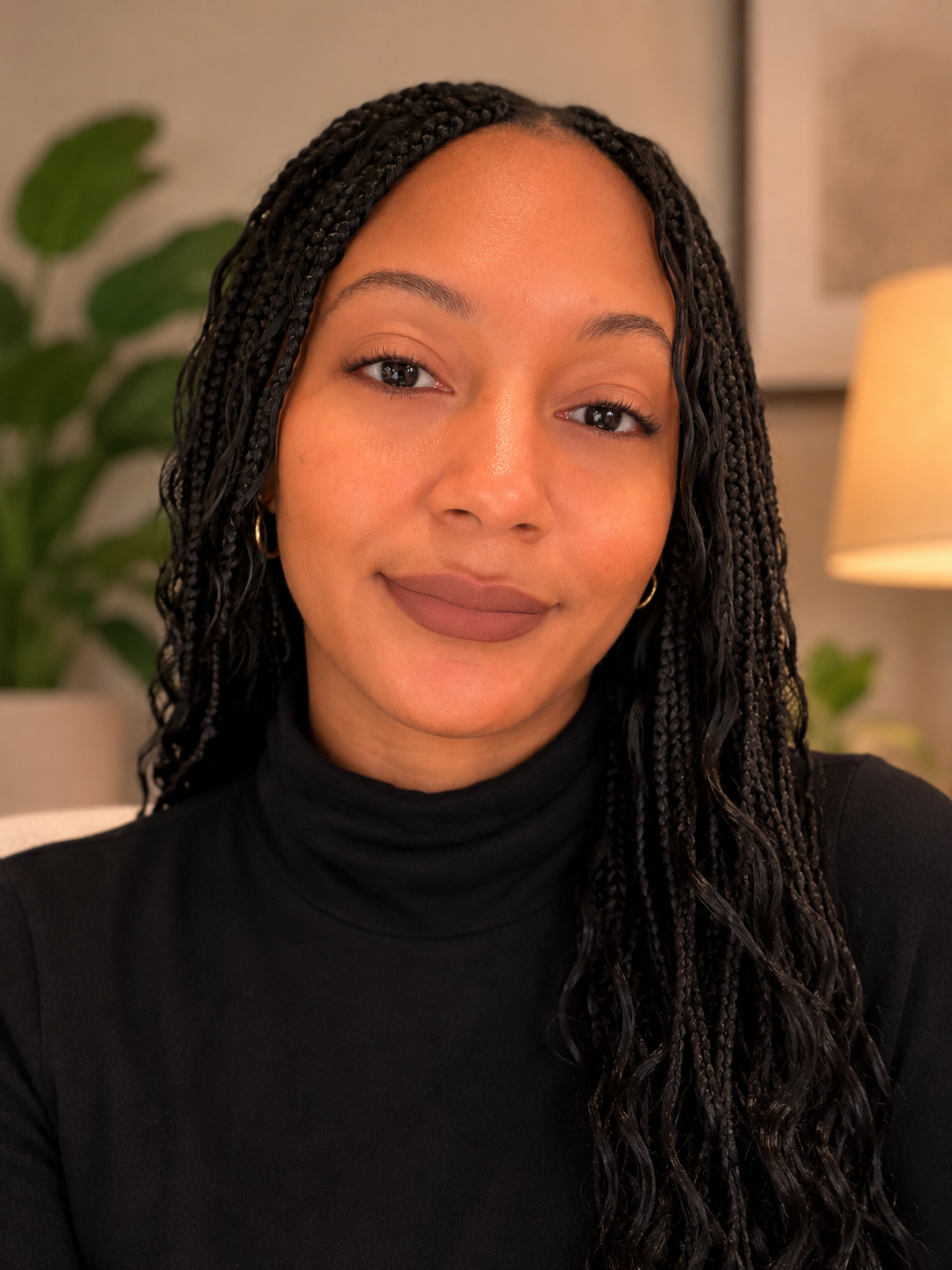 A headshot of Aysha Wells, smiling.
