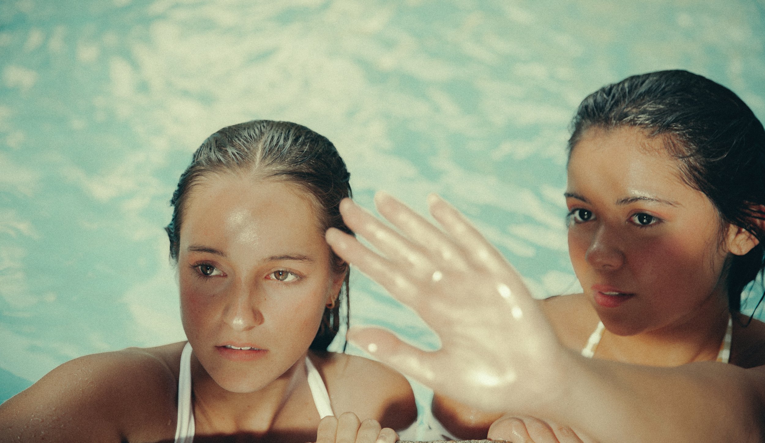 Nostalgic August poolside portrait photographed by Rayla Kay Photography in North Idaho.