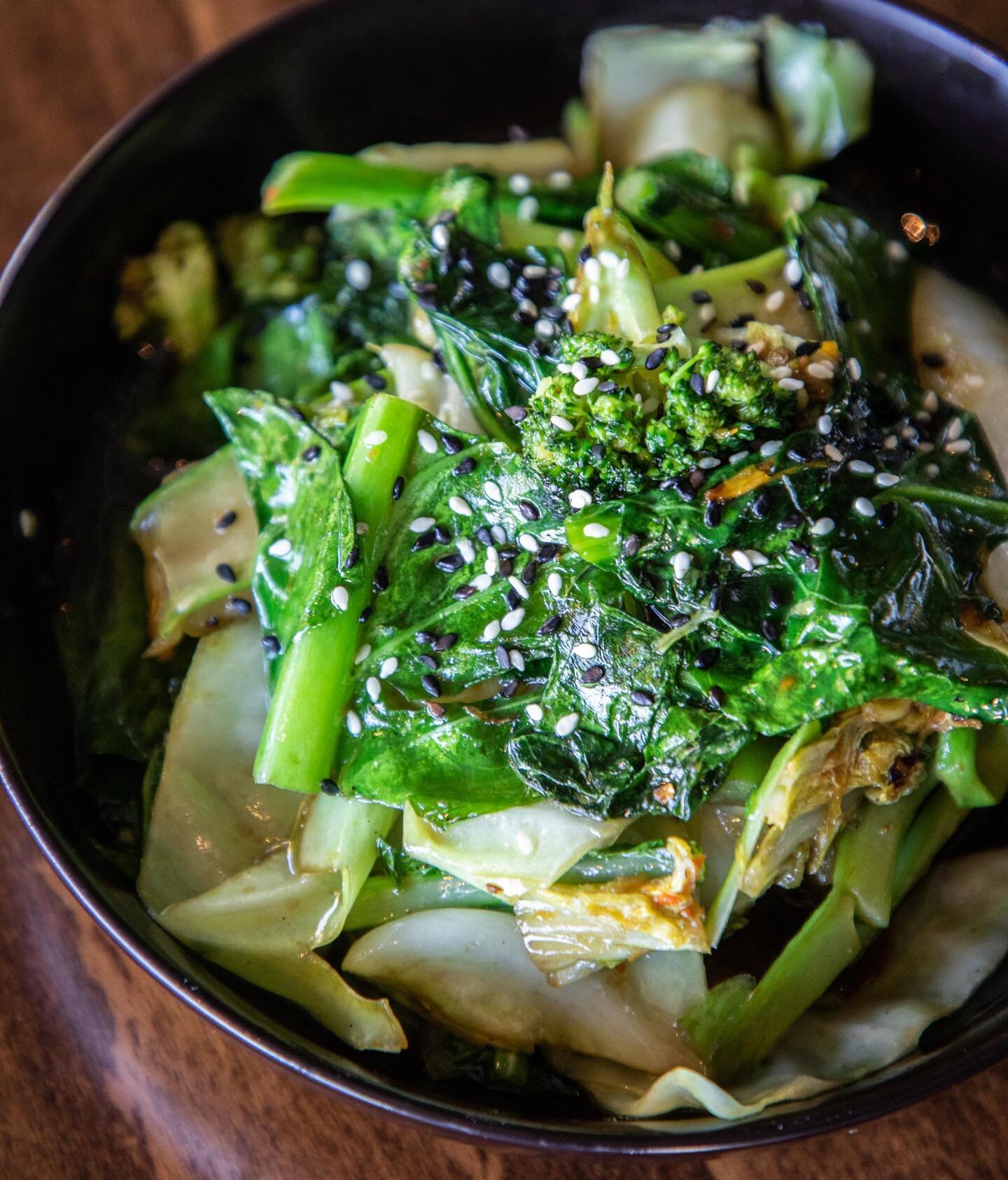 Eat your greens 🌿🌿 wok tossed greens, garlic, sesame, black ginger vinegar ✨