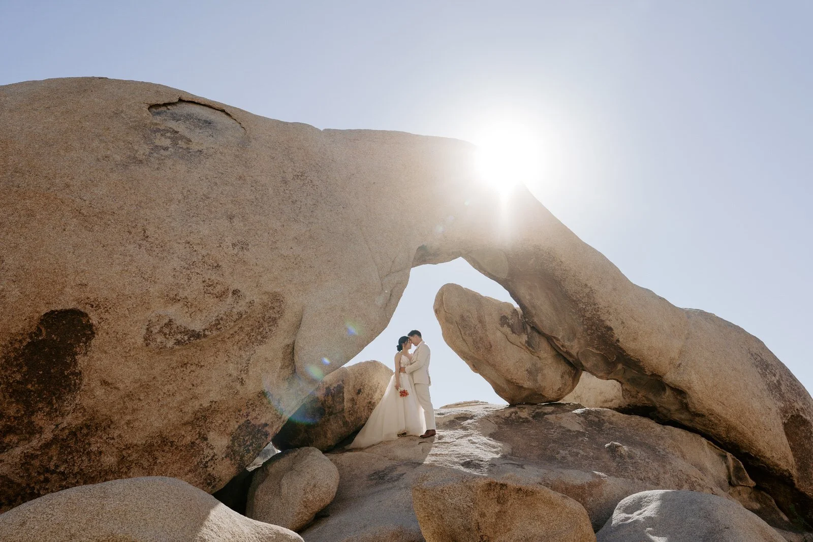 sunrise elopement portraits ar arch rock in Joshua Tree National Park