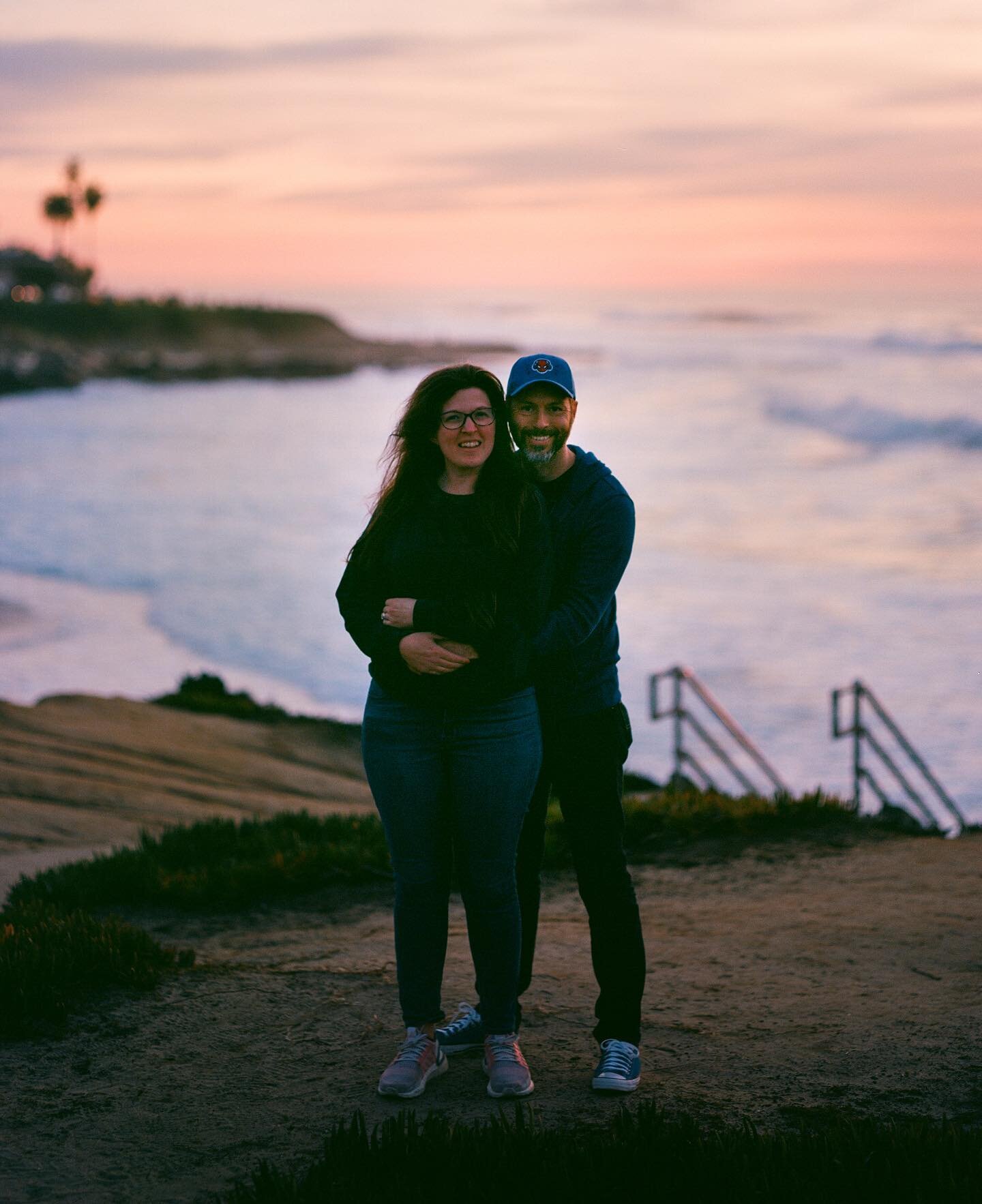 My amazing wife and me in La Jolla earlier this year. Our middle son, Aiden, officially took the photo. So, I&rsquo;d like to blame him that we were a little underexposed, but I was the one who set up the shot. 😂 Just not quite enough light left for