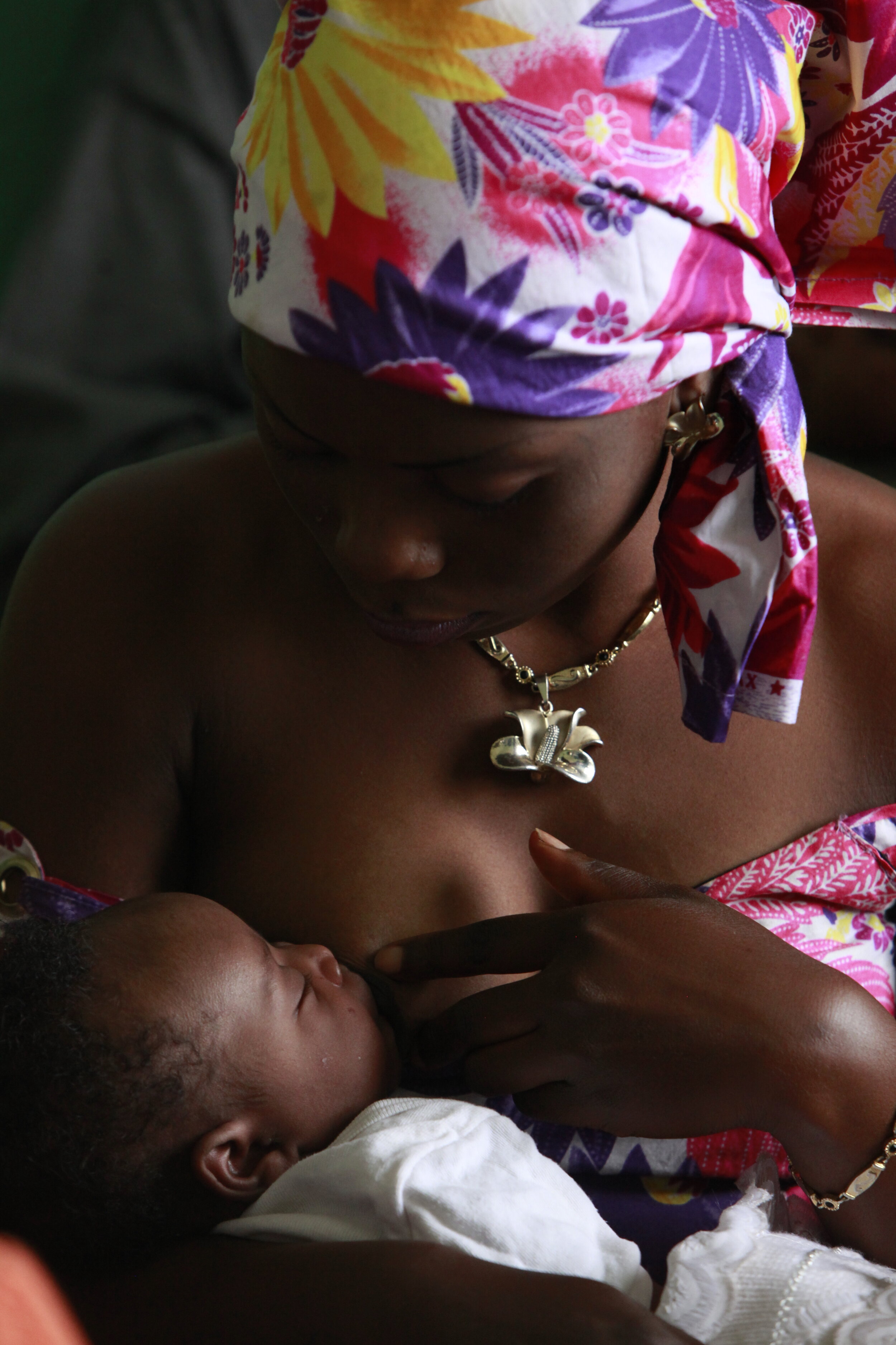  Ngoy Kisula breastfeeds her baby  Lushike Kamersu while waiting for immunizatiions at the Kenya 2 Health Center  in the Kenya health zone in Lubumbashi, Democratic Republic of Congo. 