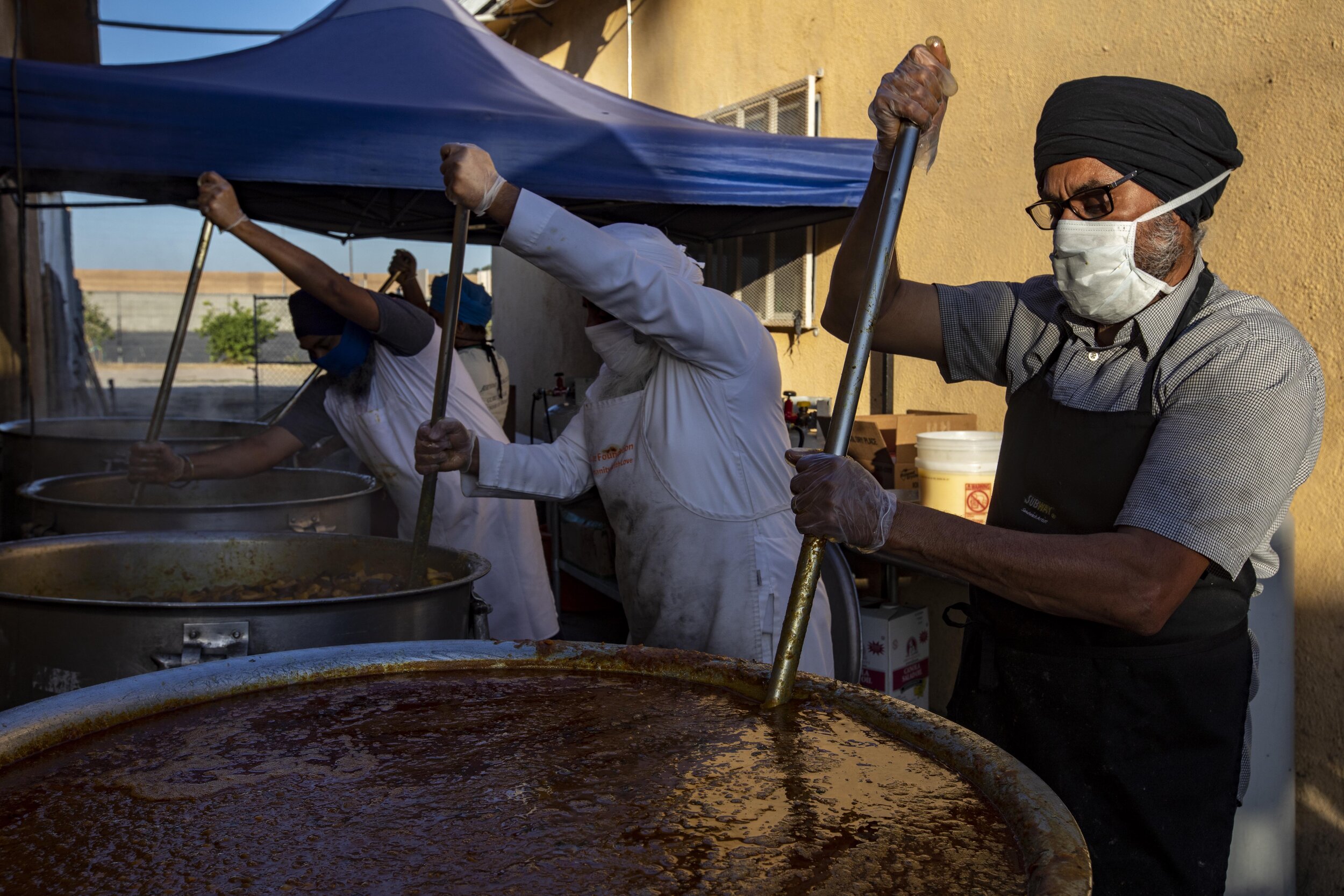  Jarnail Singh prepares food at Khalsa Care Foundation. The Sikh community is working with the Mayor's office and Department of Disability and serving 3,000 meals daily. They have 50-55 volunteers that show up Monday through Friday to make meals at t