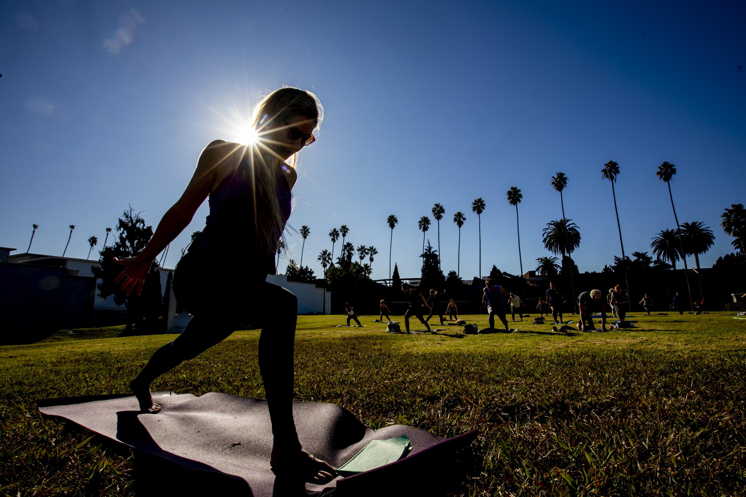  Yoga instructor Mary DeCaro (@thatlayogi) teaches her Vinyasa Flow yoga class on the Fairbanks Lawn  at Hollywood Forever cemetery in the Hollywood area of Los Angeles, Calif. The cemetery is offering  outdoor yoga classes 5 days a week, DeCaro teac