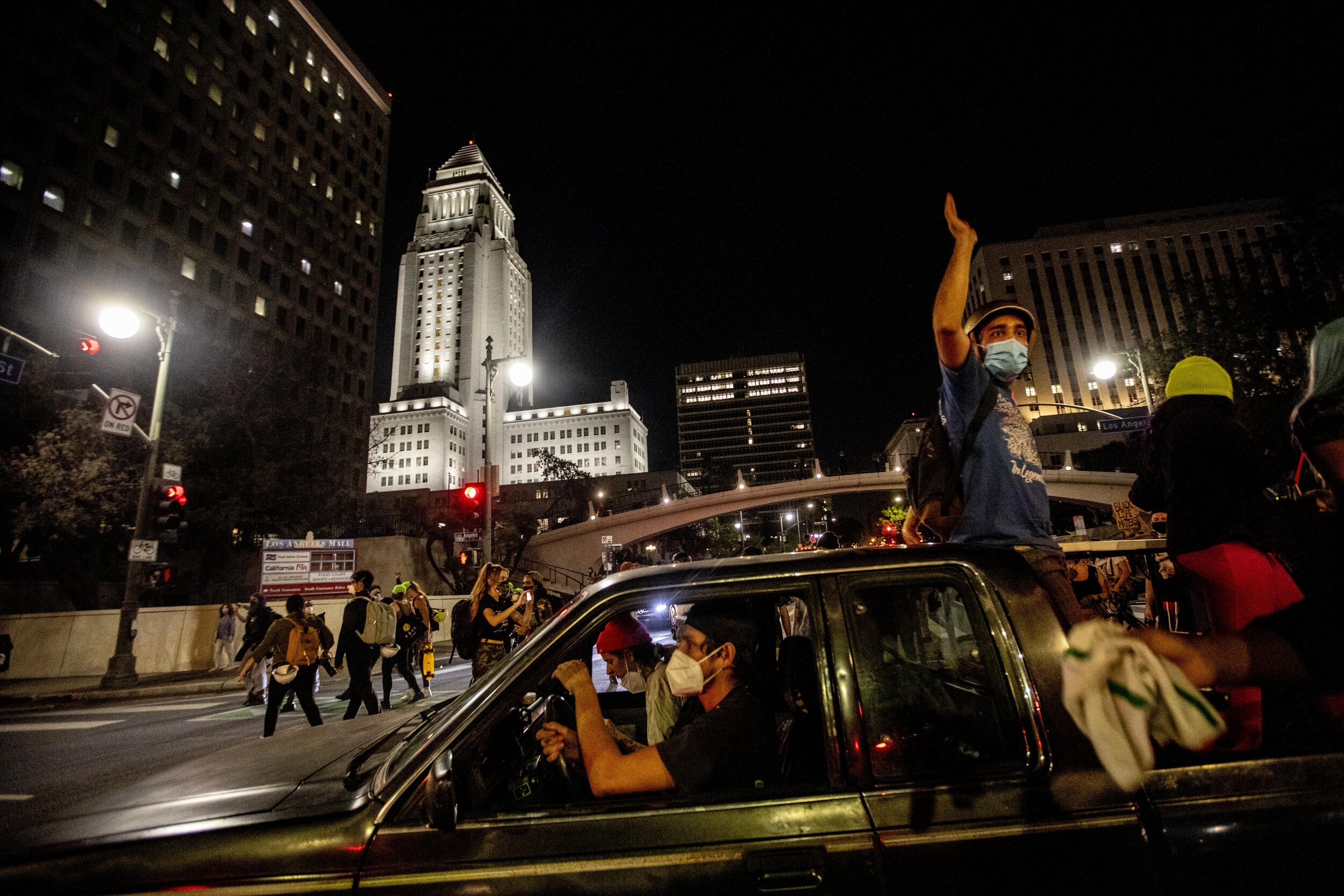  Protesters drive by near City Hall as hundreds  of protesters gathered in downtown Los Angeles to protest the decision in the Breonna Taylor case. 