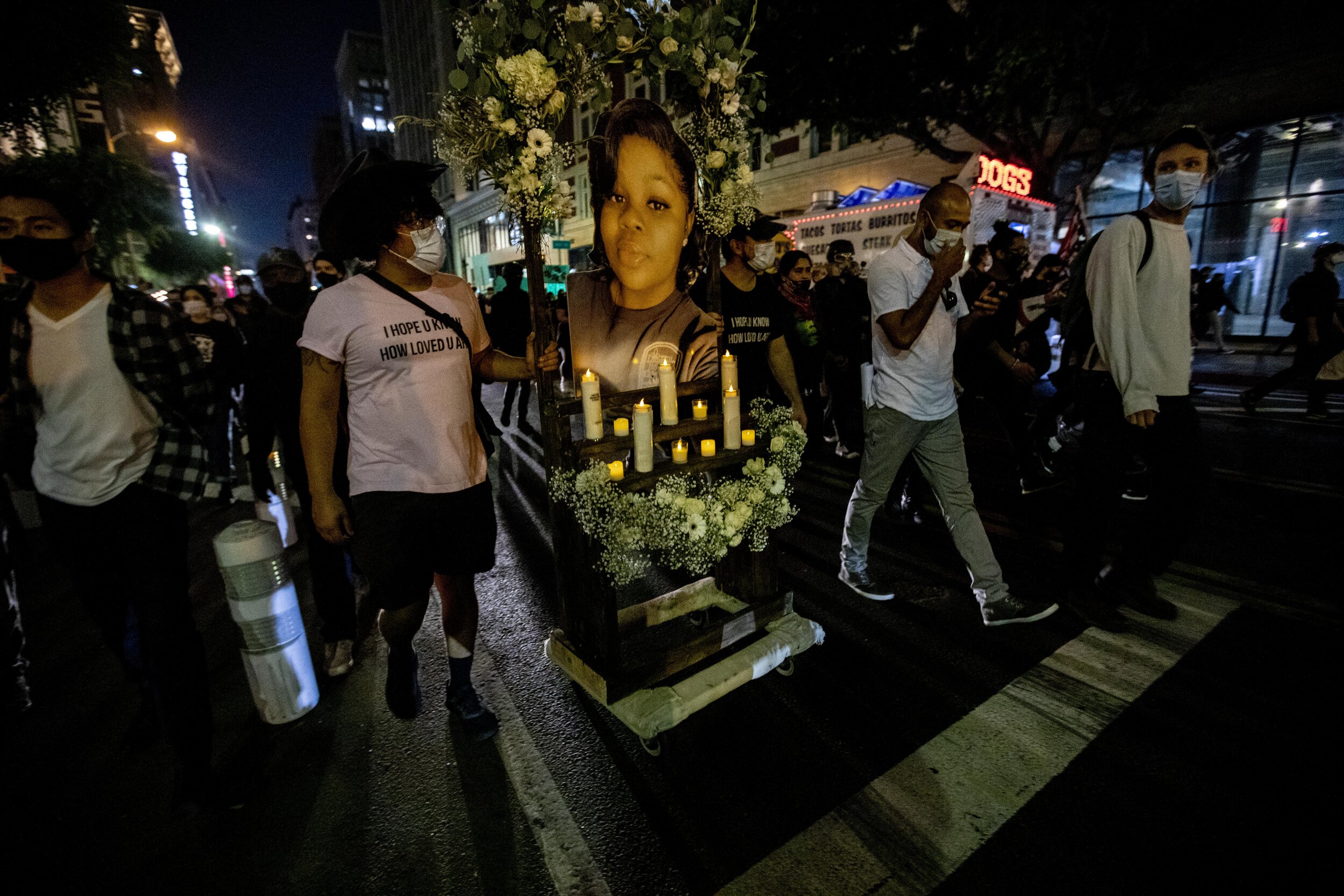  Protesters bring an altar in honor of Breonna Taylor as they march with hundreds of other protesters gathered in downtown Los Angeles to protest the decision in the Breonna Taylor case. 
