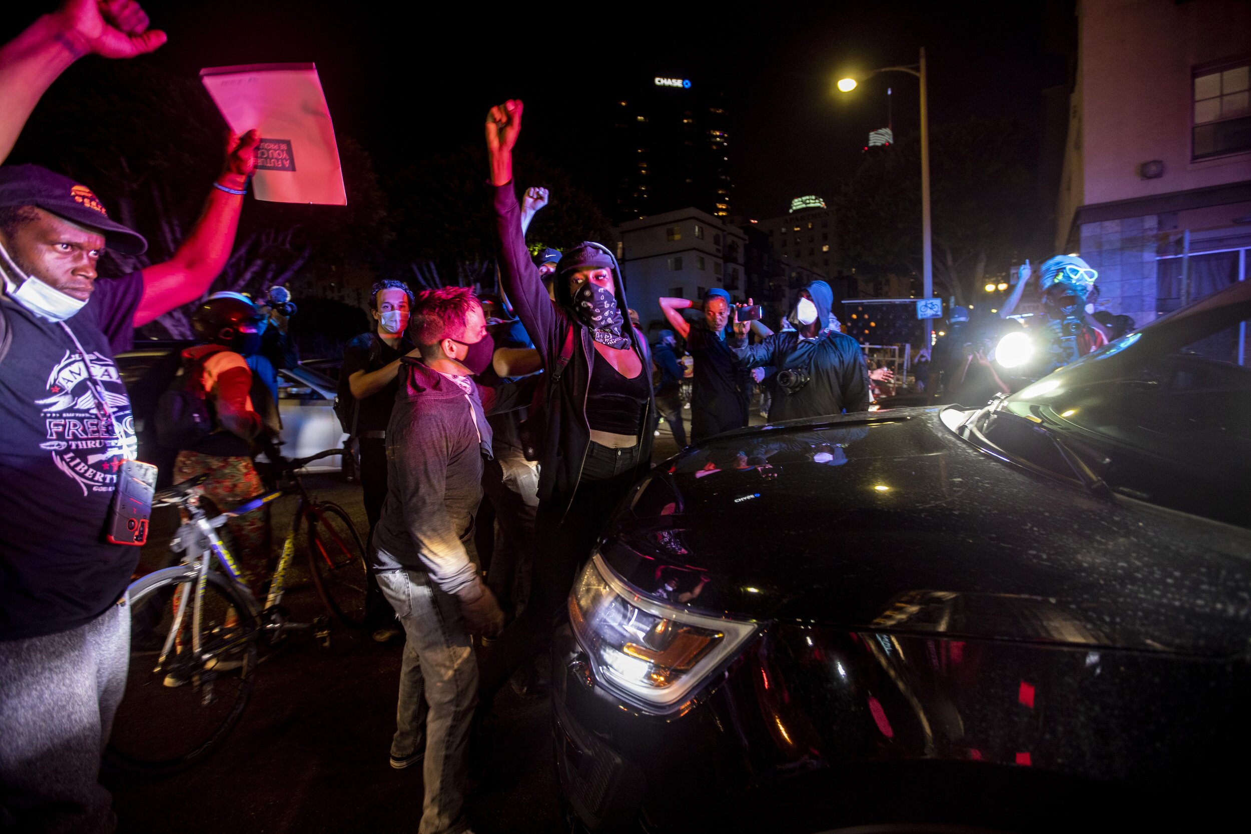  Protesters blocked a police car in downtown Los Angeles as hundreds marched to protest the decision in the Breonna Taylor case. 