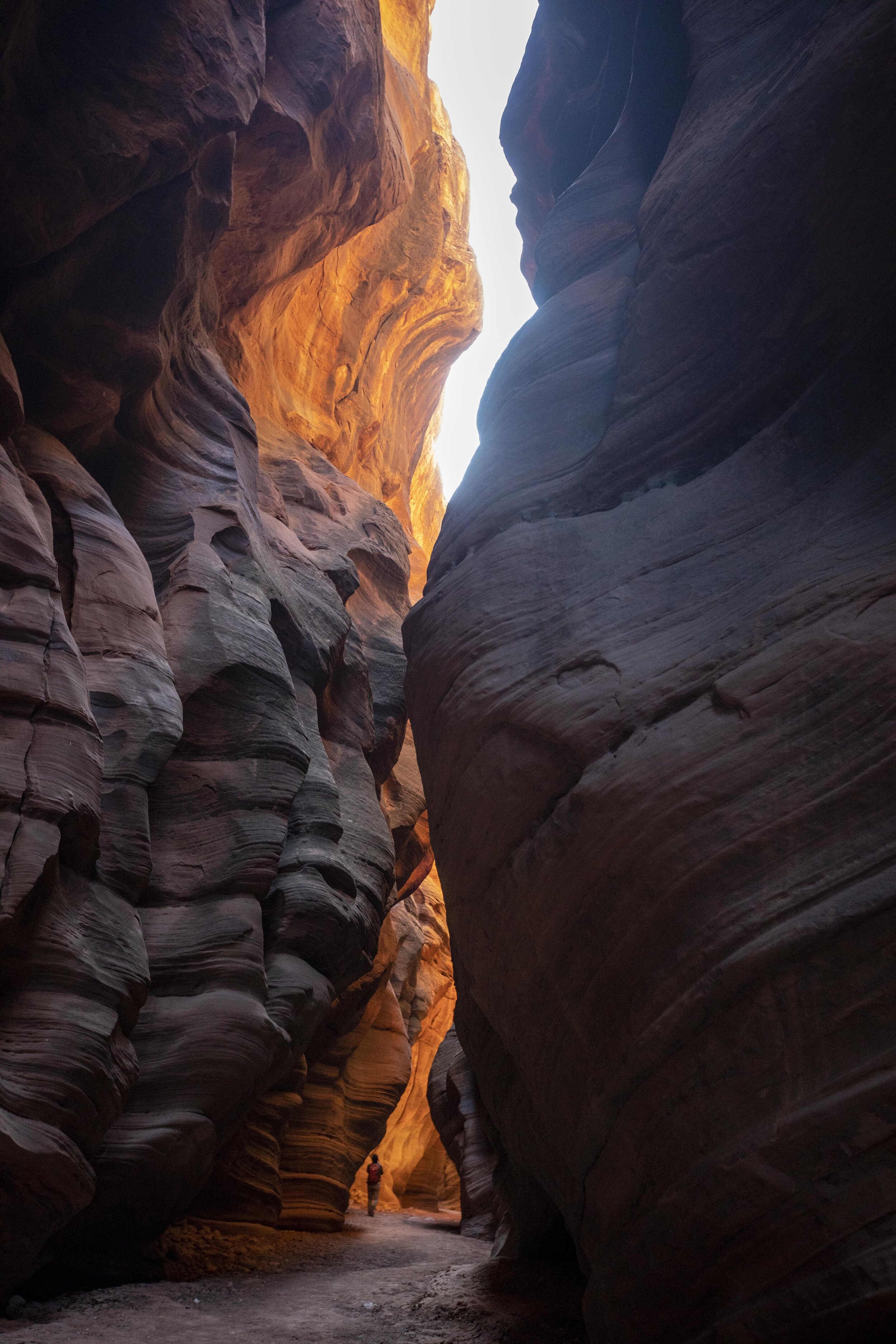  A hiker hikes in Buckskin Gulch in Utah, the longest and deepest slot canyon in the Southwestern US. It is popular with hikers and canyoneers and is possibly the longest slot canyon in the world.  