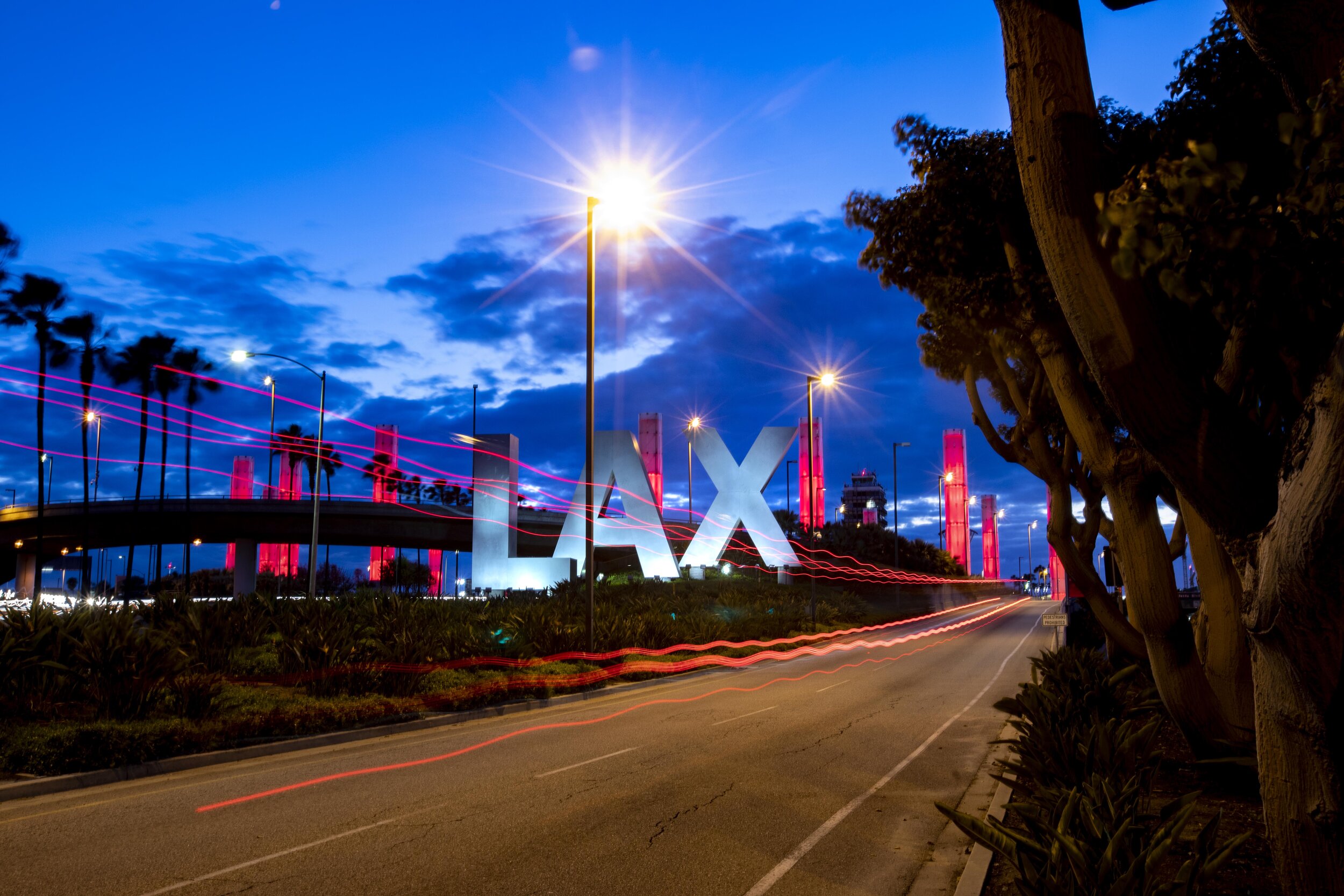  The LAX Gateway Pylons are lit up in red for Red Cross Month. There were few people at the airport due to the Coronavirus pandemic. 