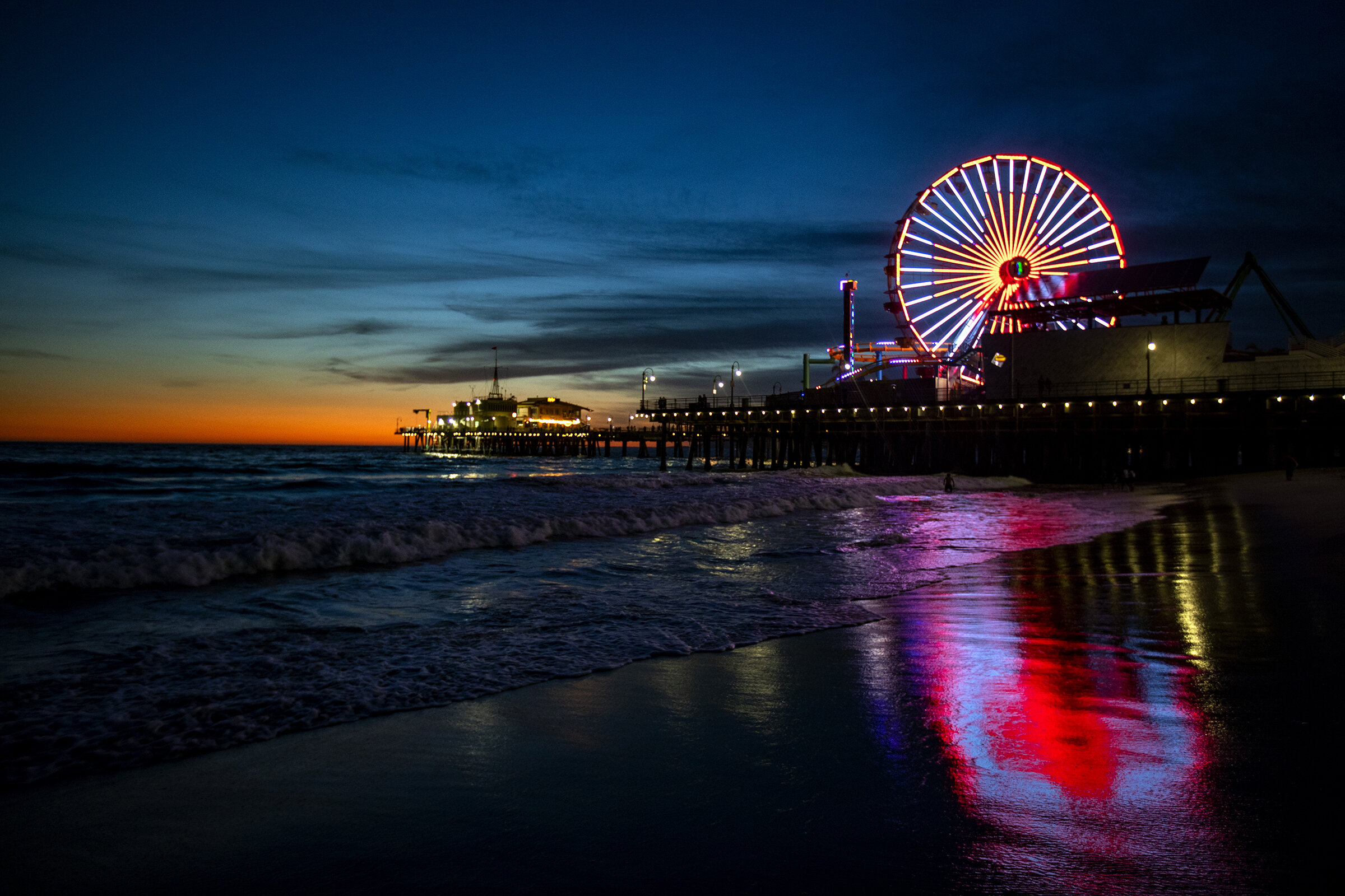 The ferris wheel at the pier at Pacific Park in Santa Monica is one of several landmarks around the greater Los Angles area that is lit up red for Red Cross Month in March.  