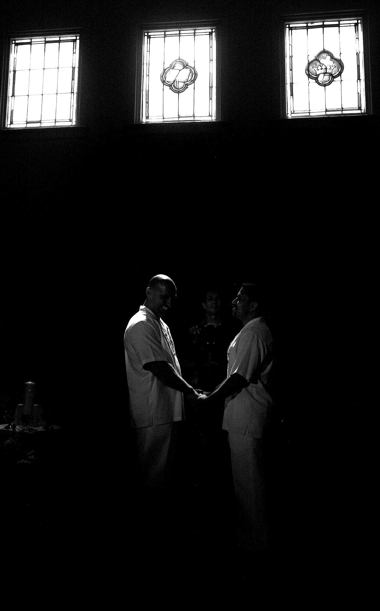  Bart Baker, left, and his partner Joe Elvis hold hands as they stand at the altar and listen to Pastor Jerrell Walls during their union ceremony at Christ Chapel, a predominantly gay Christian church in North Hollywood, Calif. Their union is valid s