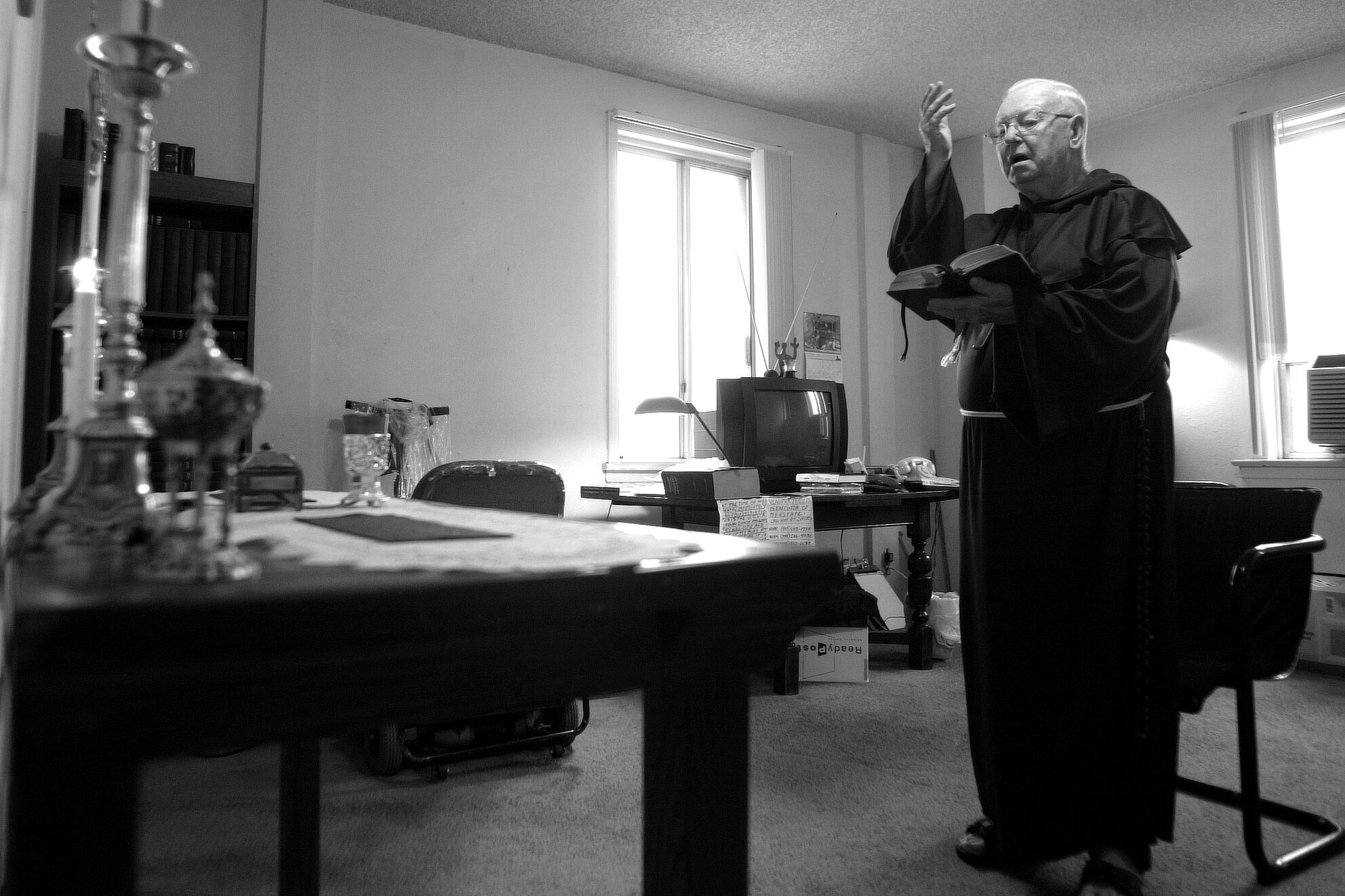  Harry Barton at the altar he has set up in his apartment. He is a secular Franciscan and prays numerous times a day.  