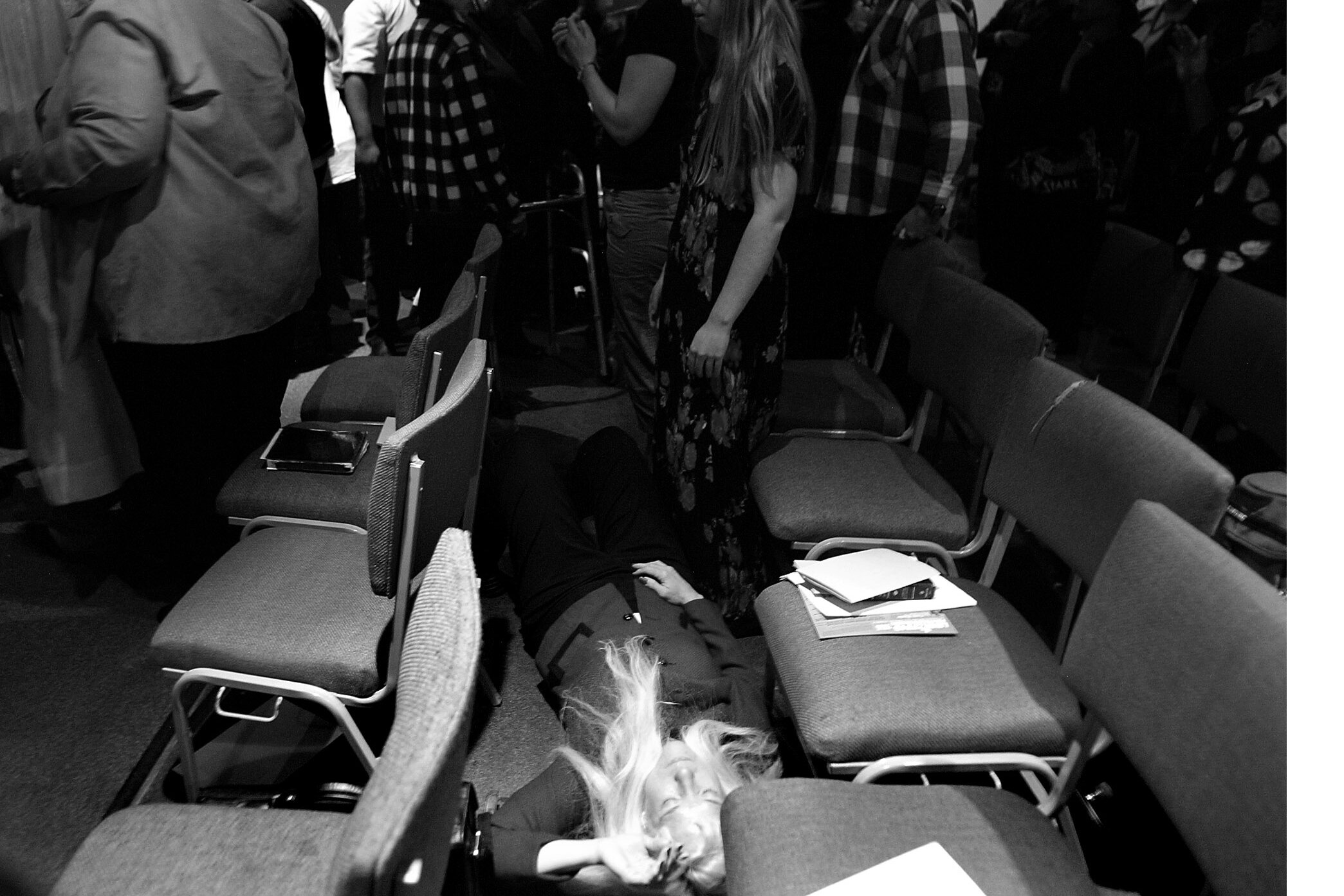  Rev. Linda McQuowen lays on the floor having a spiritual experience during the Liberating Pentecostalism celebration at Unity Fellowship Church in Los Angeles.  