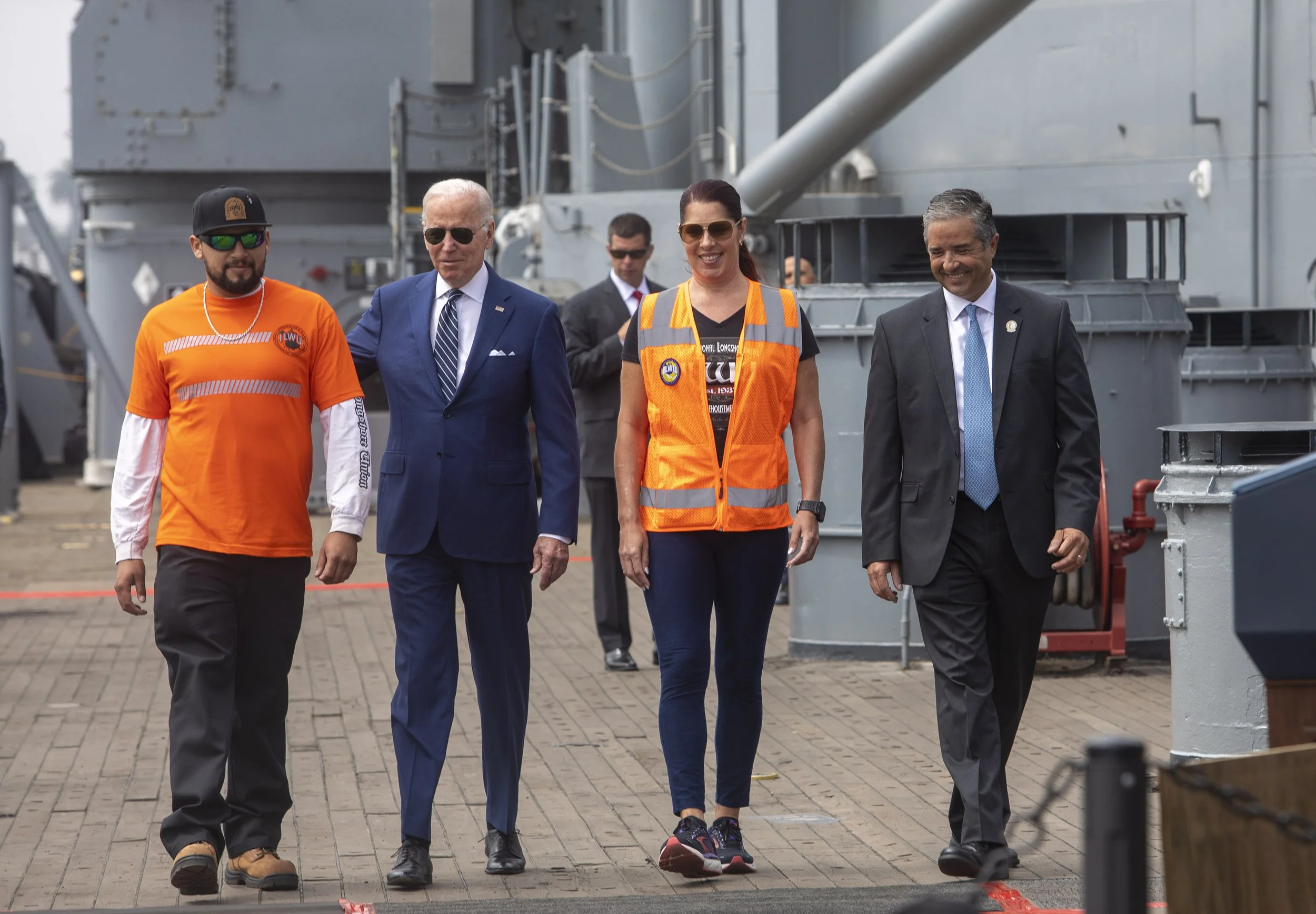  President Joe Biden spoke about inflation, shipping companies and supply chain issues from the deck of the USS Iowa at the Port of Los Angeles in the San Pedro area of Los Angeles. President Biden arrives  with David Ross (left) and Jaime Hipsher (r