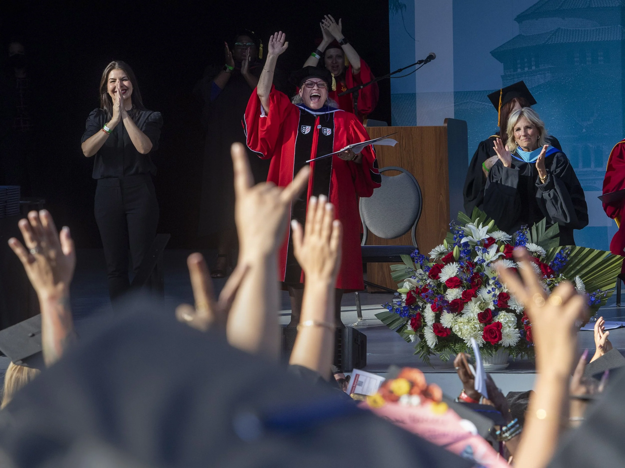  LA City College President Mary Gallagher waves as First Lady Jill Biden claps at the LA City College graduation at the Greek Theater in Los Angeles. Biden, who was the keynote speaker,  is a community college professor in Virginia. This is the first