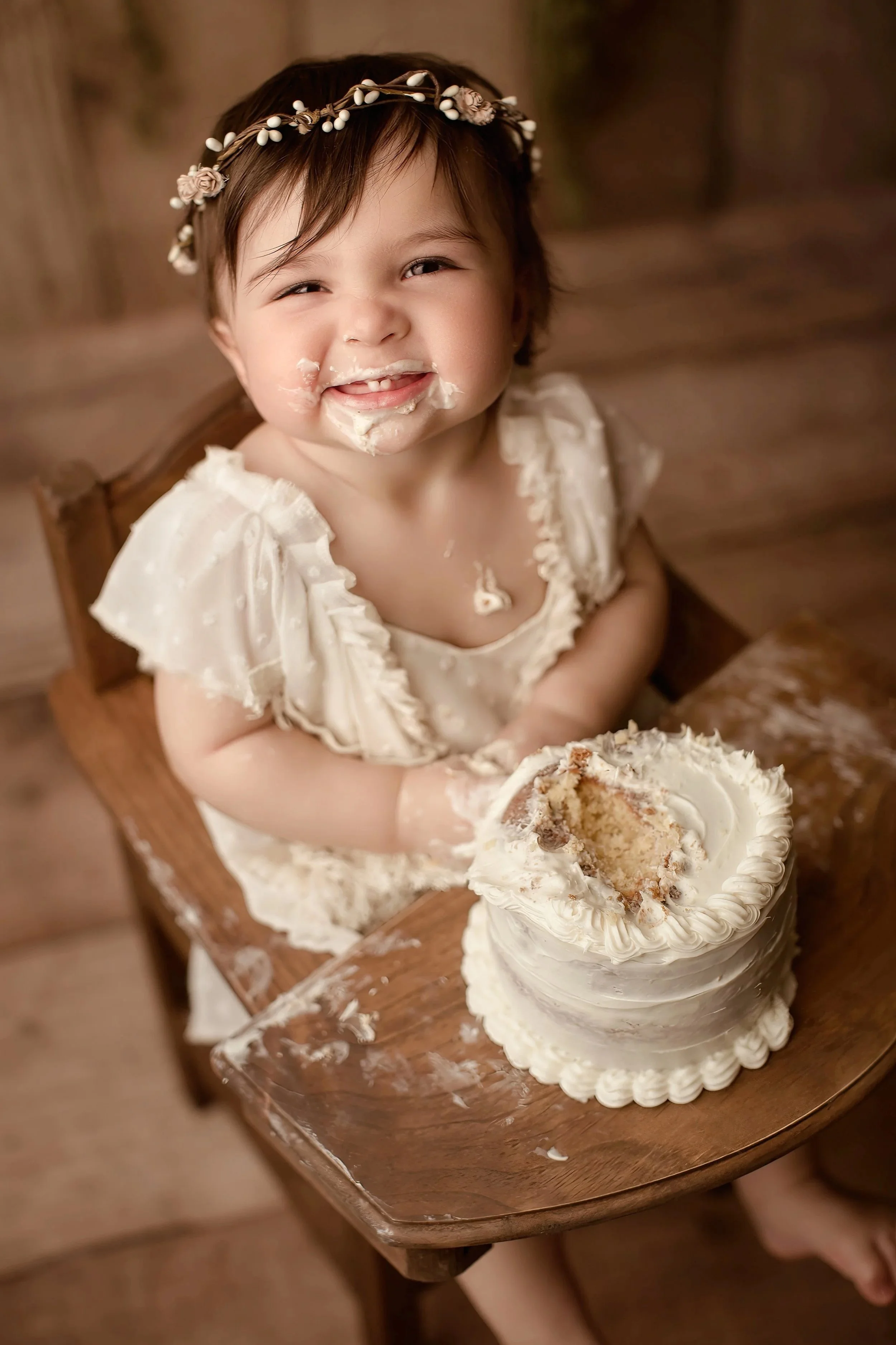 Baby girl does a cake smash in the Bay Area of California