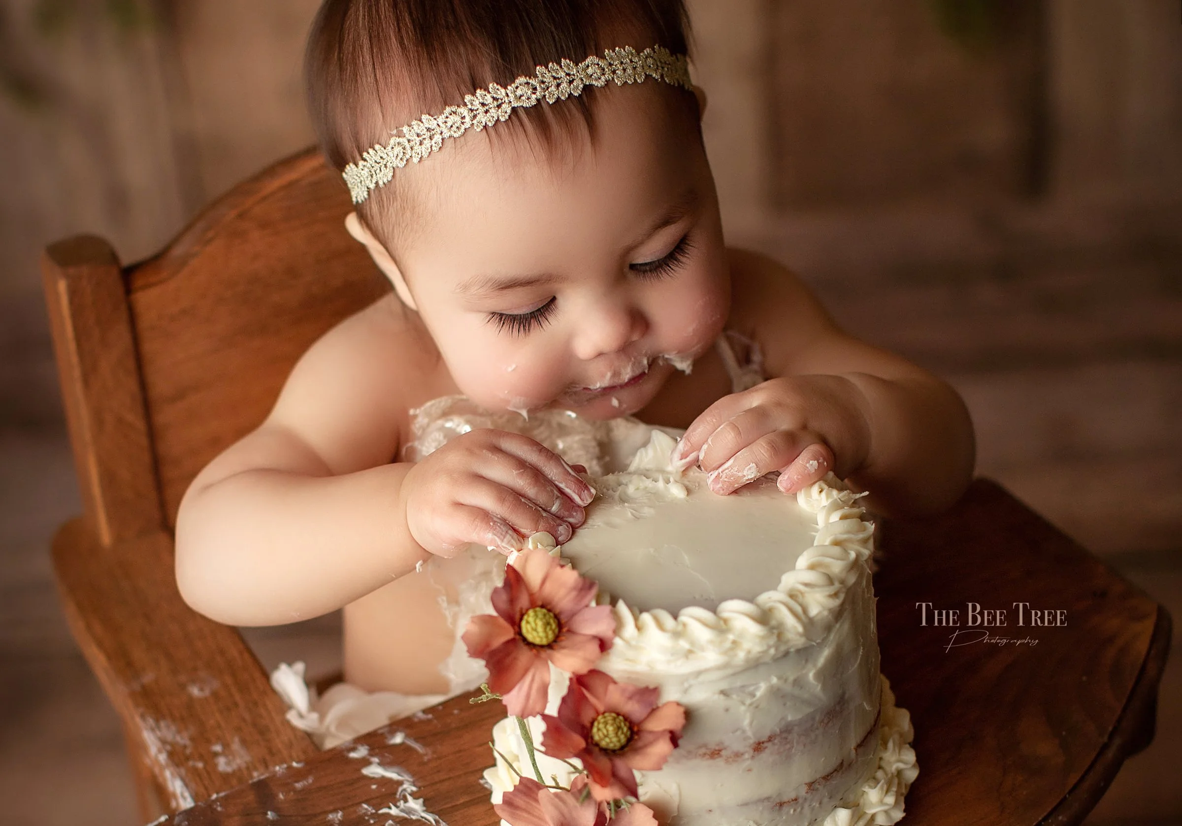 Best Bay Area Cake Smash Milestone photographer takes photos of baby on first birthday doing a photoshoot with a smash cake in her Fairfield Northern California studio
