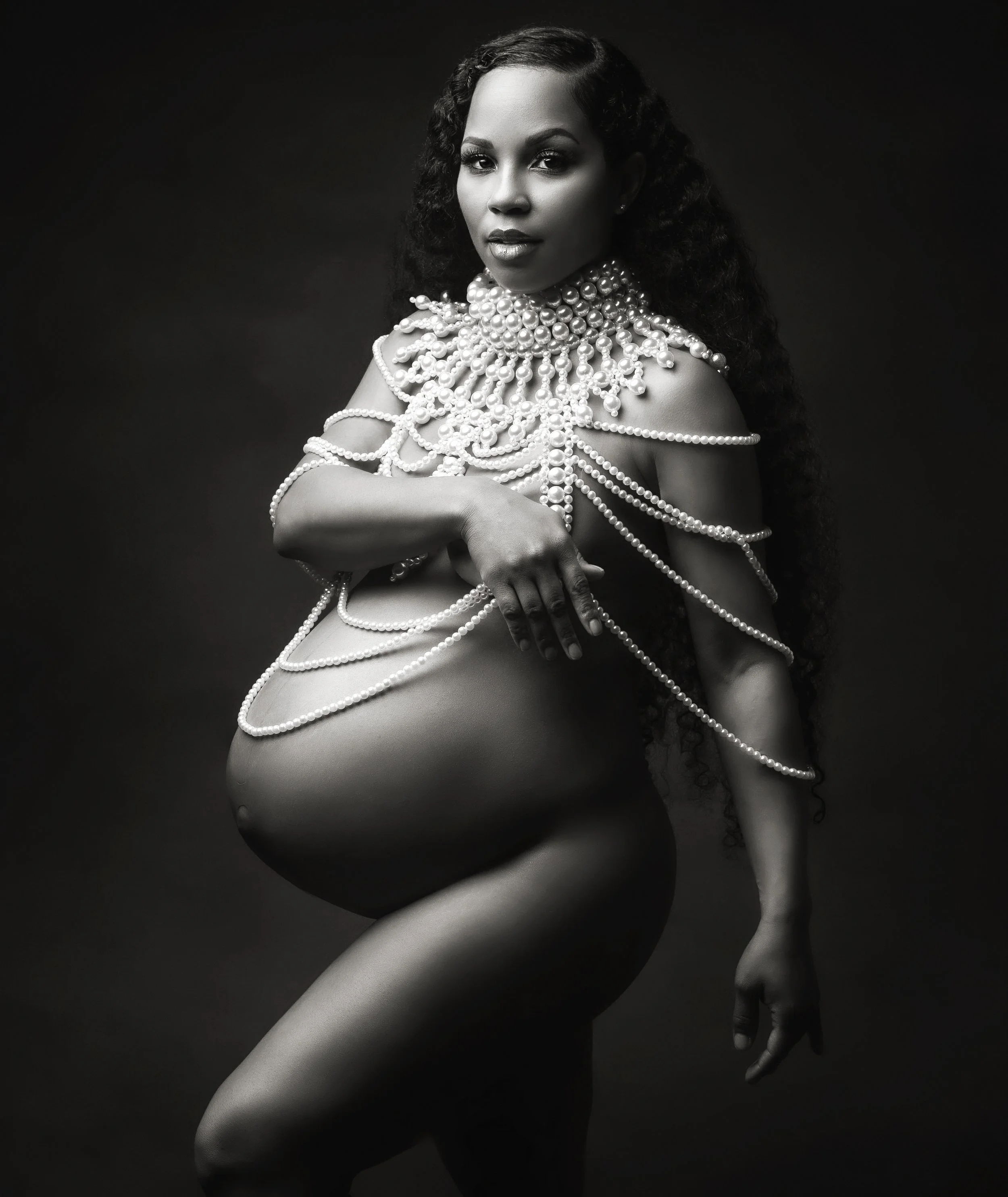 Bay Area studio maternity photography with professional lighting, focusing on baby bump and elegance.