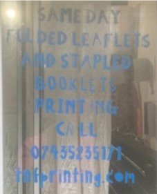 tnf instore folded leaflet window vinyl.jpg
