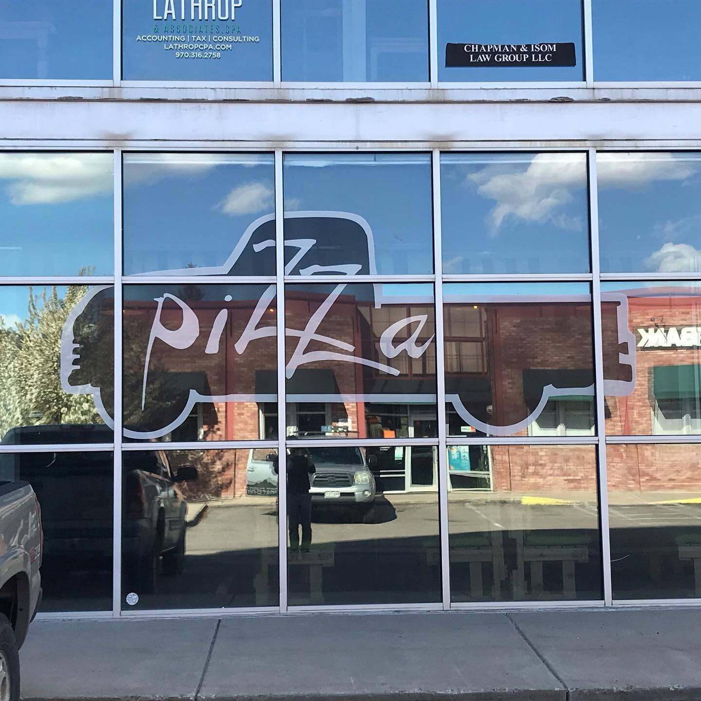 Perforated vinyl window graphics for @pickupspizza in Edwards. Big impact outside with little impact on the view from inside.