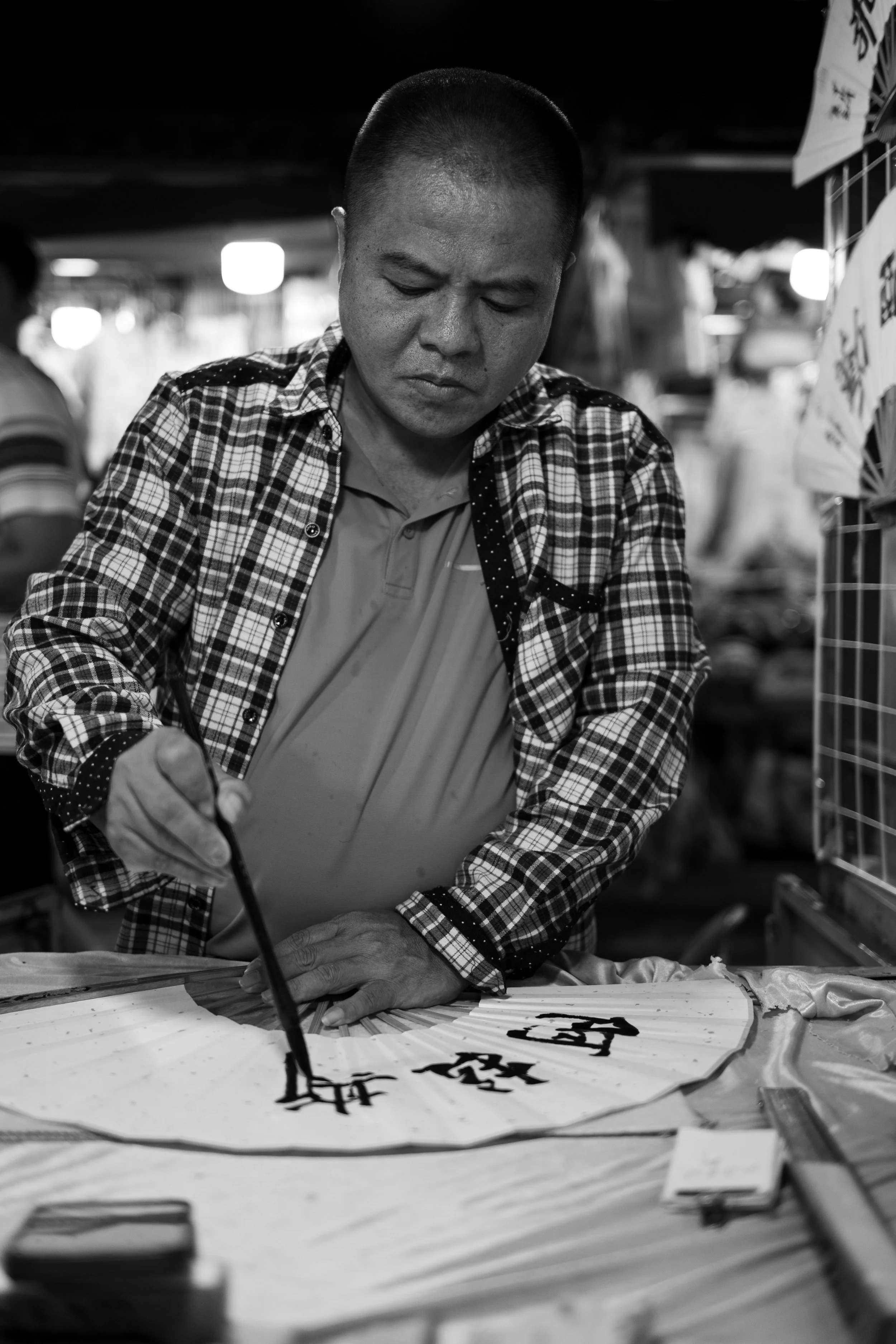 Alastair being written in Chinese Characters on a fan I was gifted by my friend, Glen.