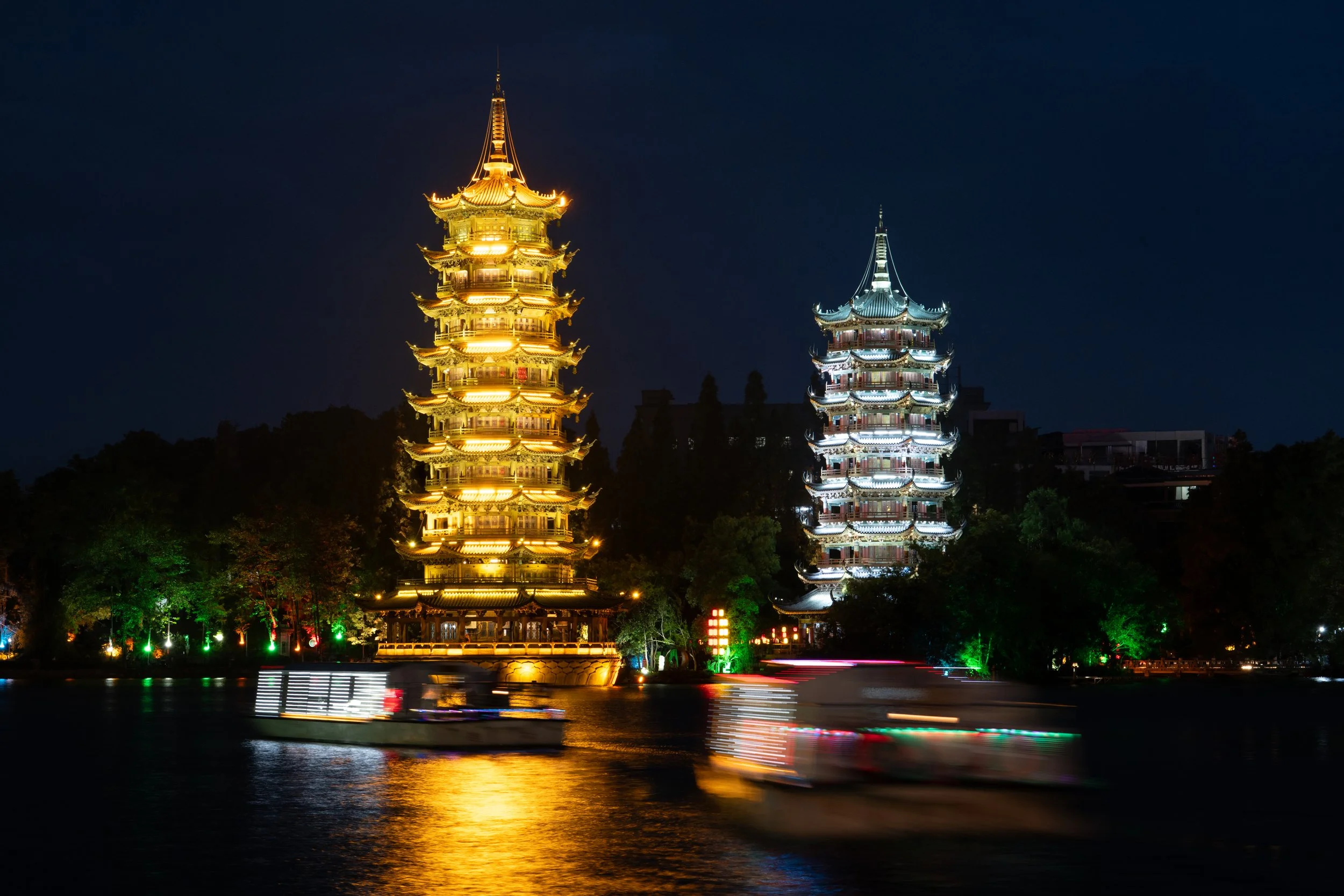 Sun and Moon Pagodas with boats