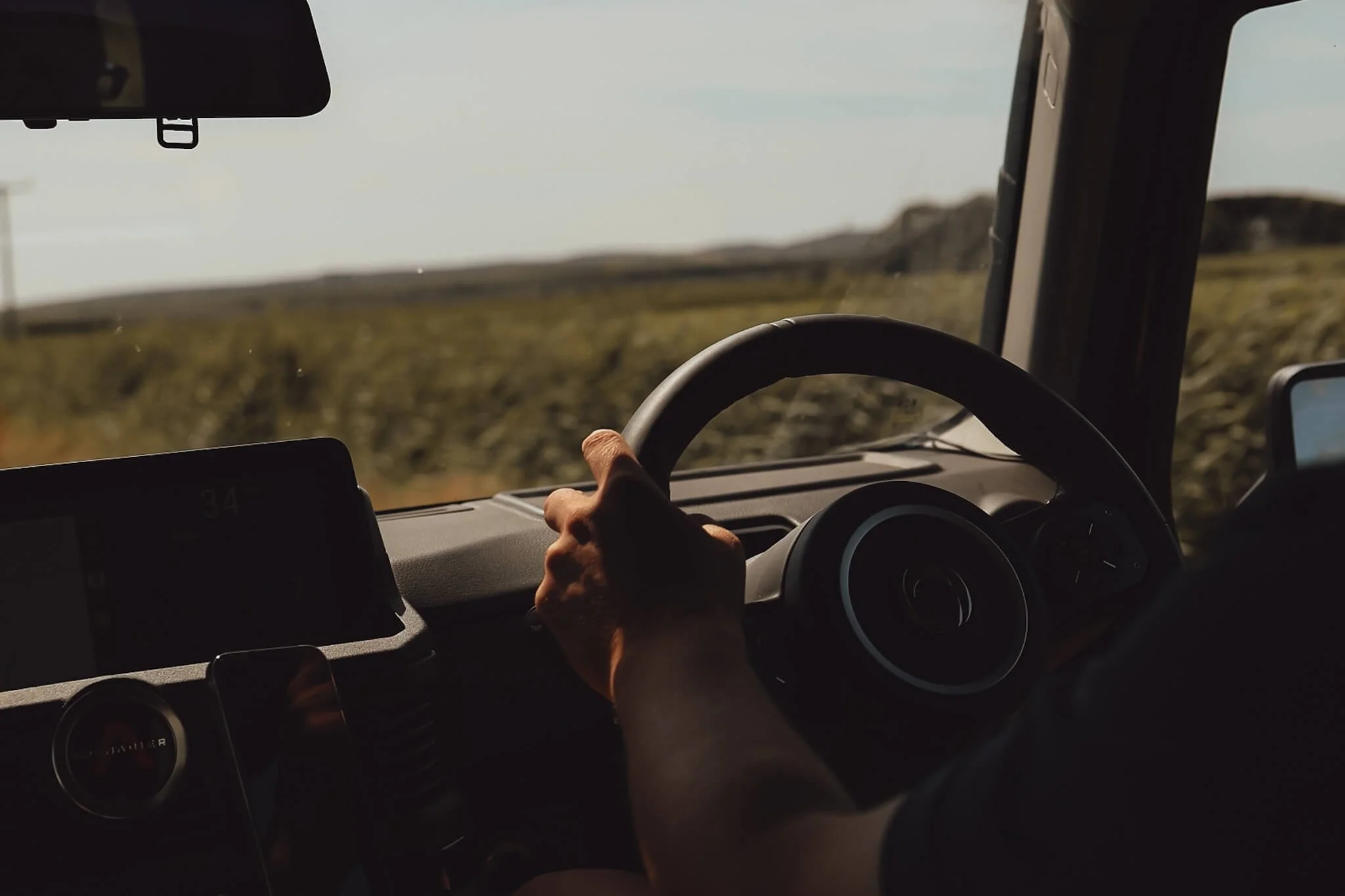 Car driving on the Isle of Skye and using a Skye map